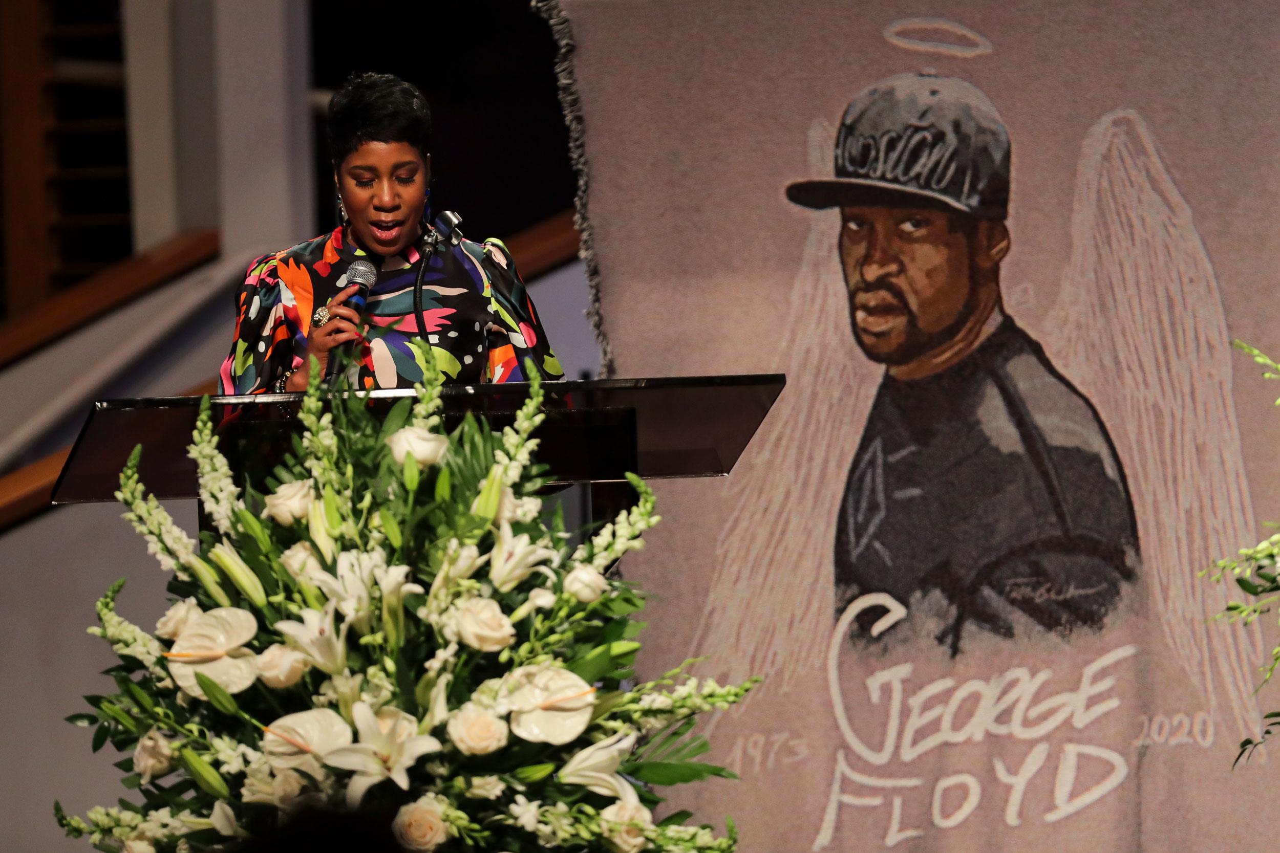 Ivy McGregor reads a resolution during the funeral for George Floyd on June 9 at The Fountain of Praise church in Houston.