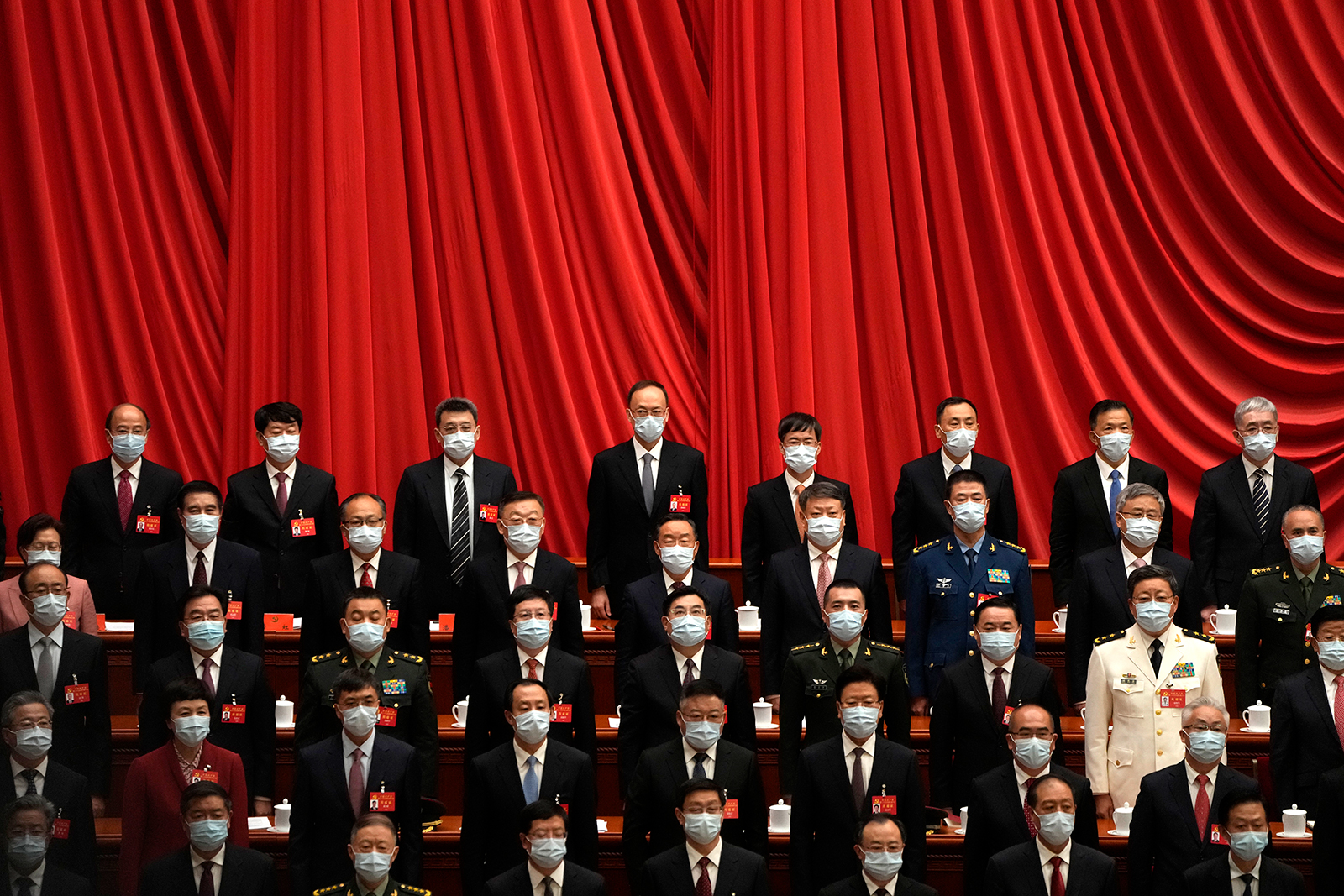 Delegates wear masks as they attend the opening ceremony of the 20th National Congress of China's ruling Communist Party in Beijing on October 16.