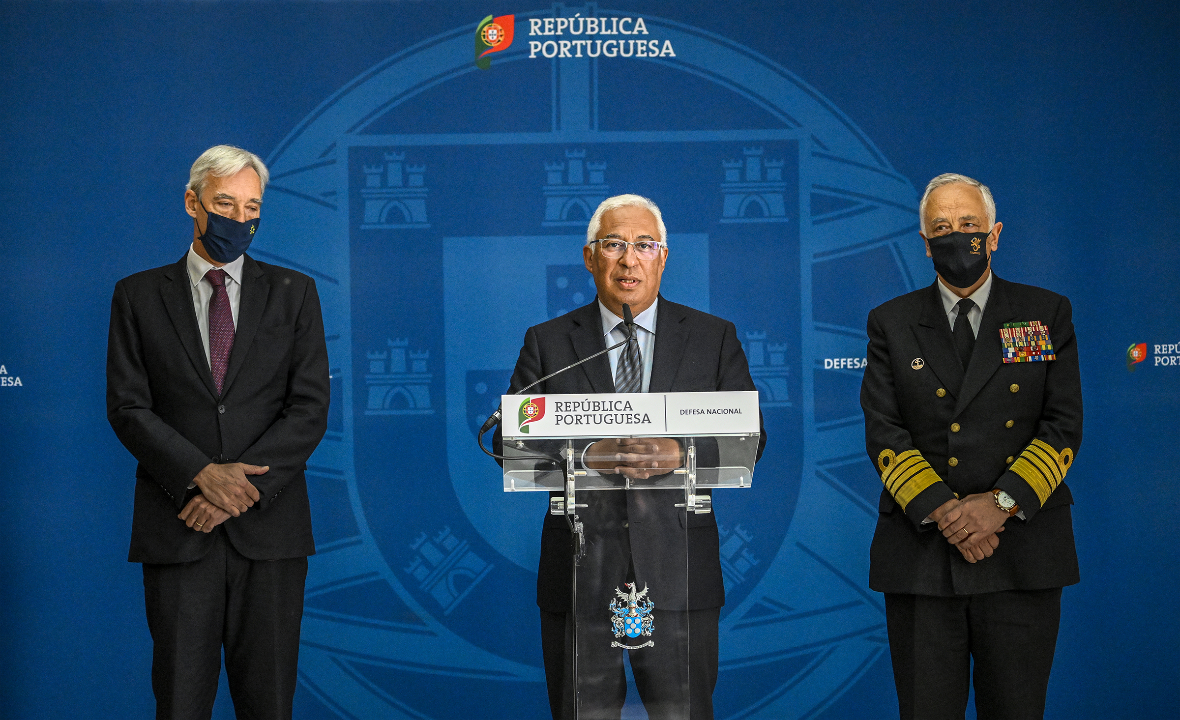 Portuguese Prime Minister Antonio Costa, center, flanked by Defense Minister Joao Gomes Cravinho, left, and the Chief of Armed Forces General Staff Admiral António da Silva Ribeiro as he speaks to the media after attending the NATO Extraordinary Virtual Summit of Heads of State and Government meeting to discuss Russian military invasion to Ukrainian on Friday, February 25, 2022, in Lisbon, Portugal. 