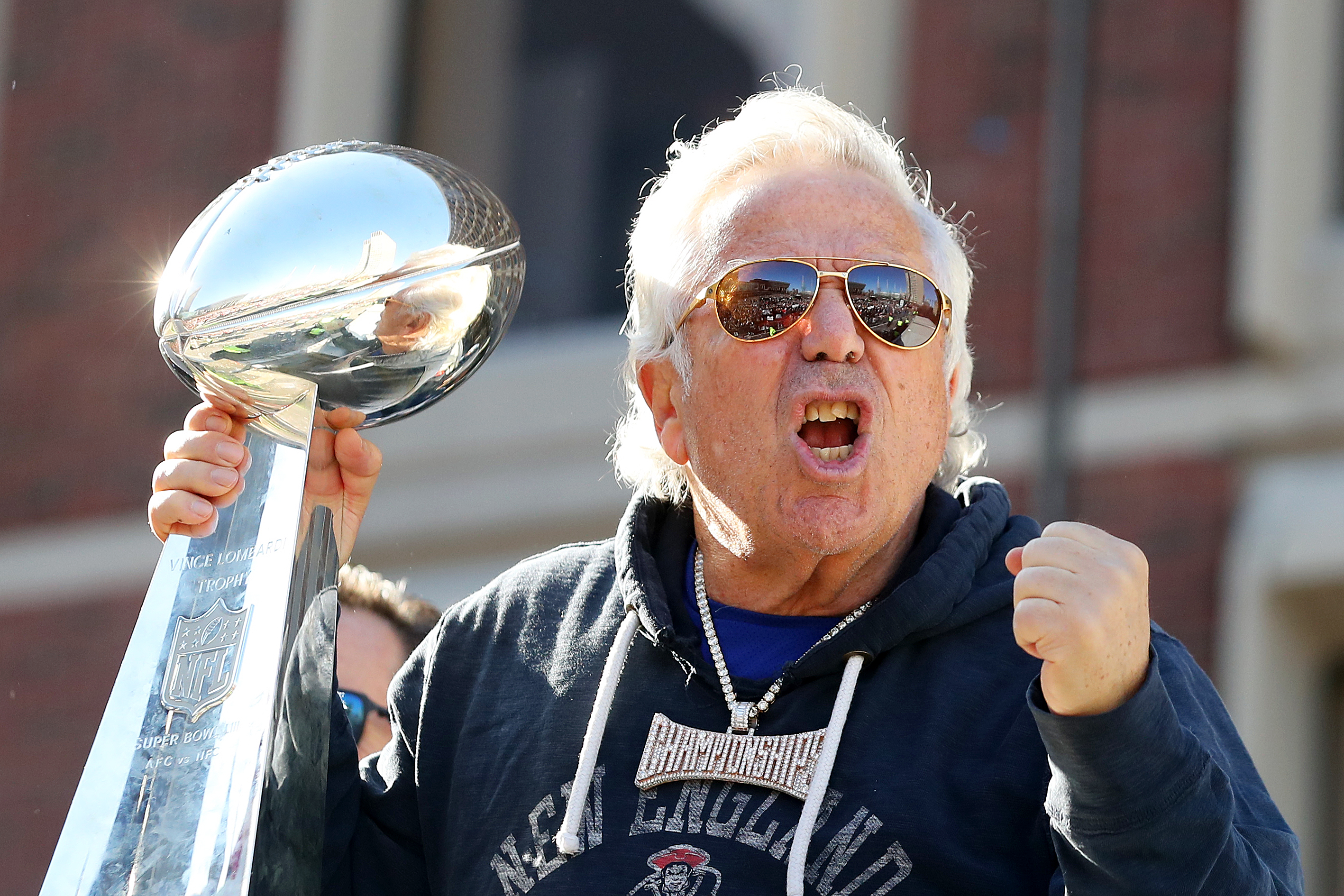 Patriots owner Robert Kraft celebrates on Cambridge street during the New England Patriots Victory Parade on Feb. 