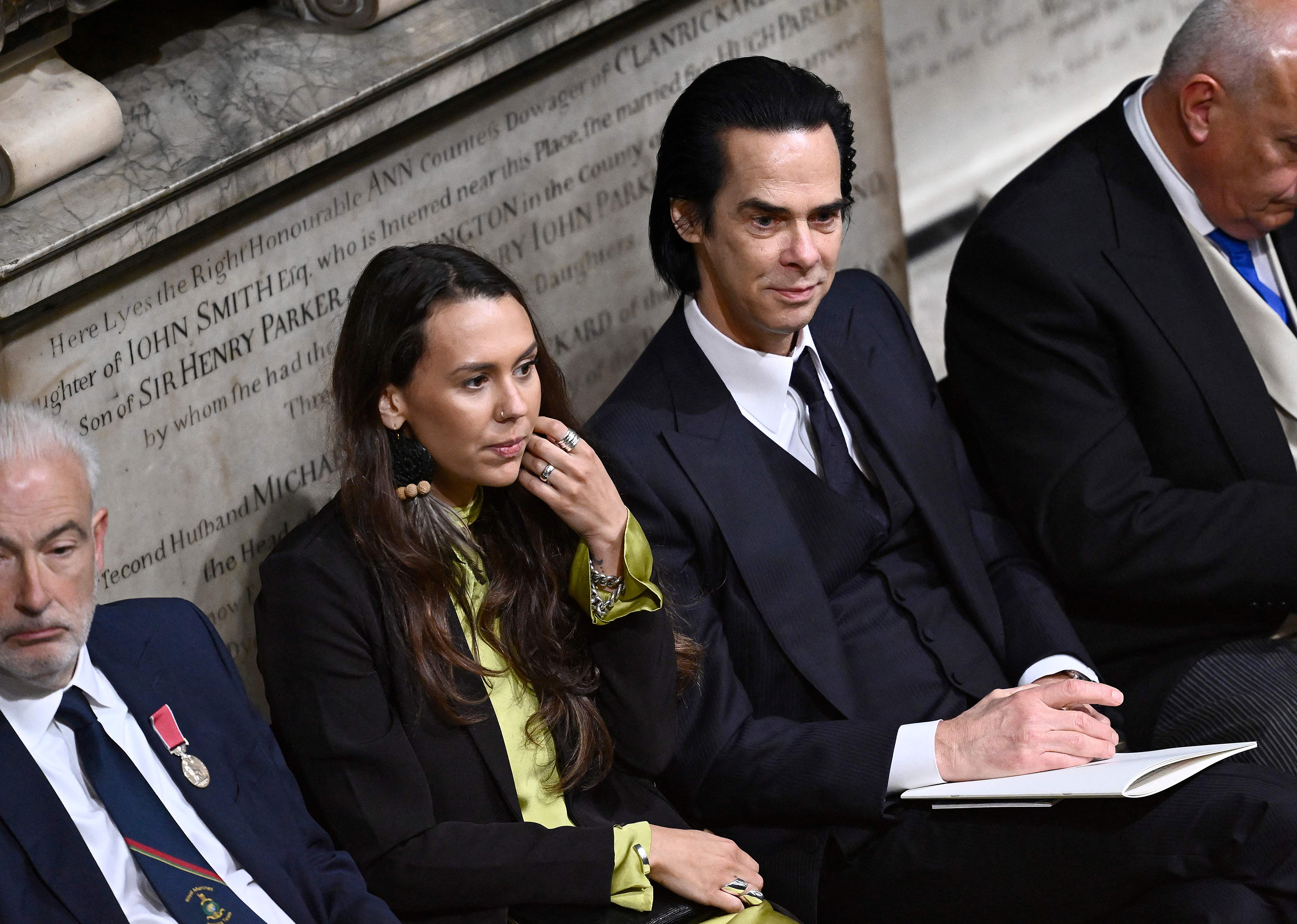 Australian songwriter and singer Nick Cave (R) attends the coronations of Britain's King Charles III and Britain's Camilla, Queen Consort at Westminster Abbey in central London on May 6.