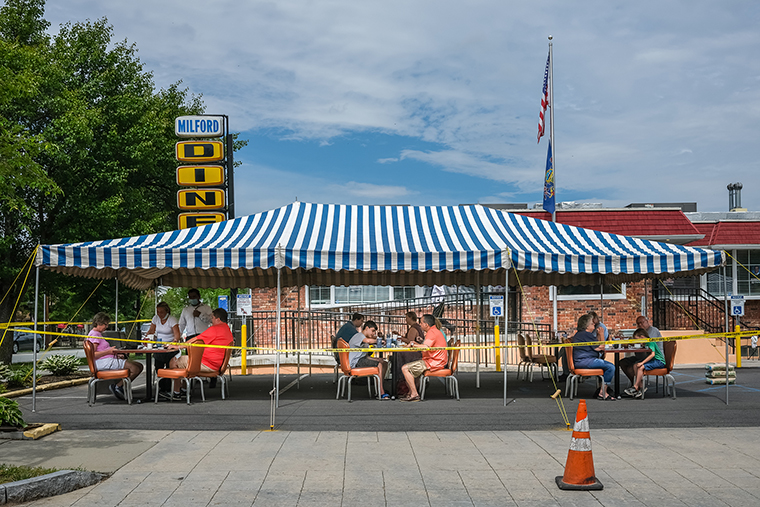 People are seen drinking and eating at a restaurant in Milford, Pennsylvania, on May 6. 