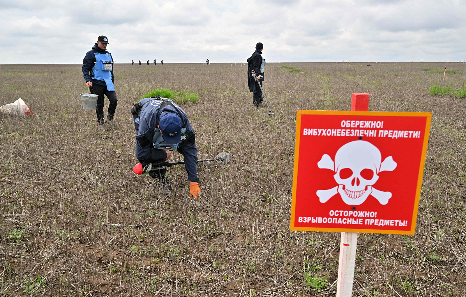 HALO Trust deminers clear a farmers' land from explosives near the village of Yevgenivka, in the Mykolaiv region in Ukraine on April 9.