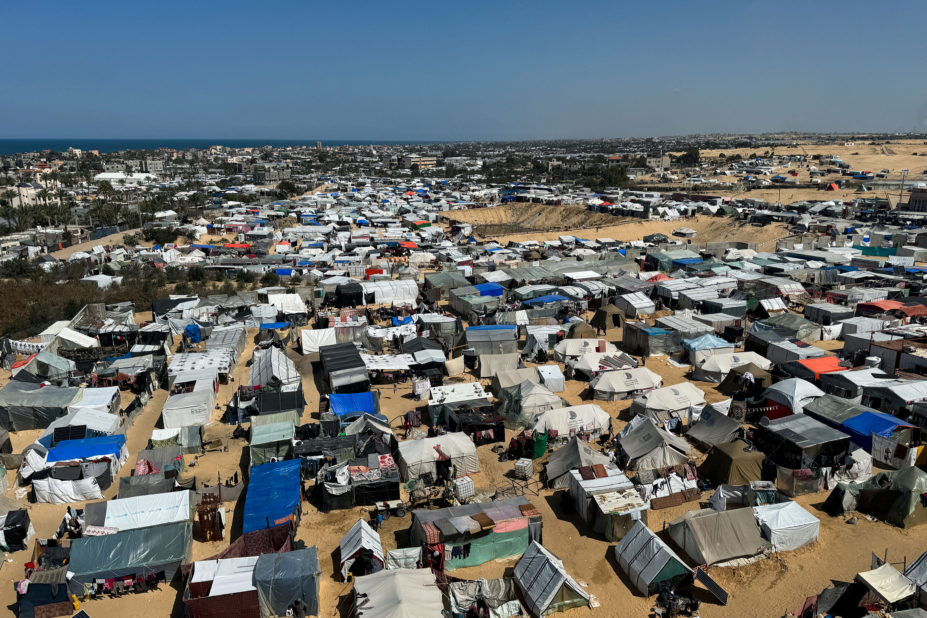 Displaced Palestinians, who fled their houses due to Israeli strikes, shelter in a tent camp in Rafah, Gaza, on March 11. 