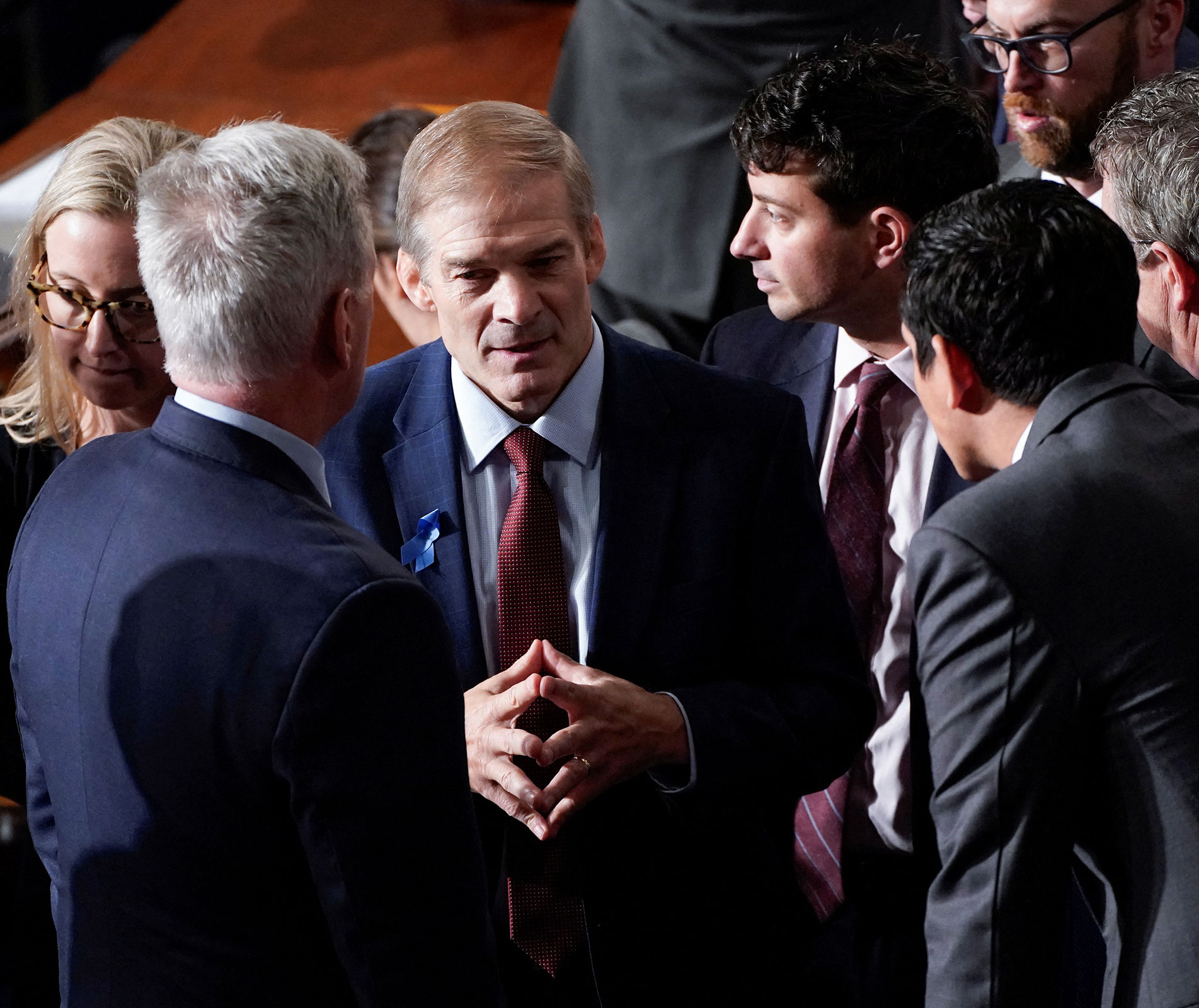 Rep. Jim Jordan confers with fellow Republicans including former House Speaker Kevin McCarthy on Wednesday.