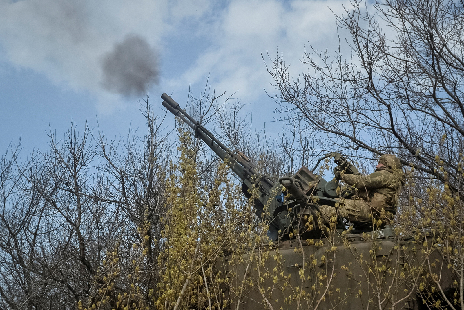 Ukrainian servicemen fire a military vehicle with anti-aircraft cannon near the front line city of Bakhmut, Ukraine on April 7.