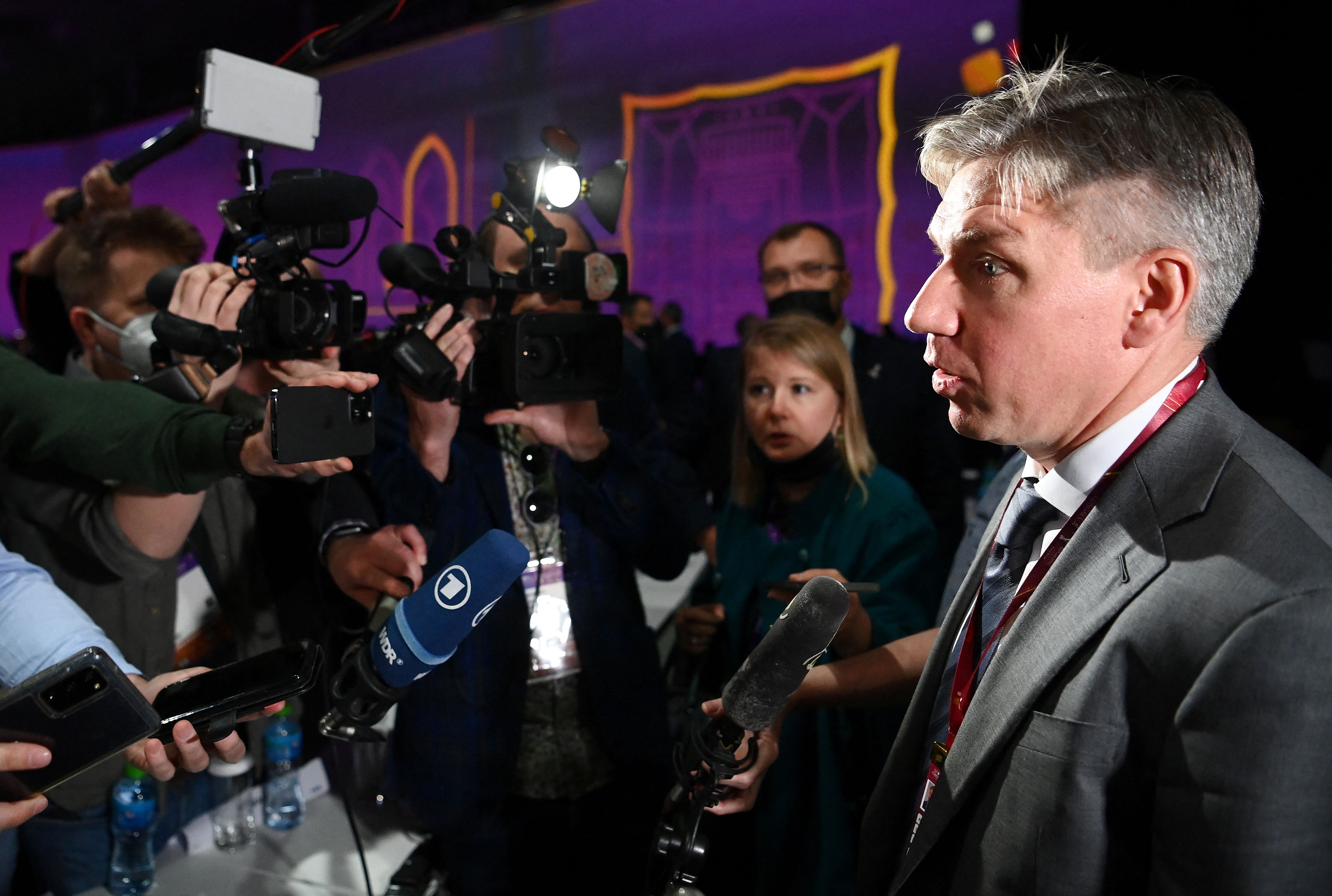Russian football administrator Alexey Sorokin, right, answers journalists' questions at the end of the 72th FIFA Congress in Doha, Qatar, on March 31. 