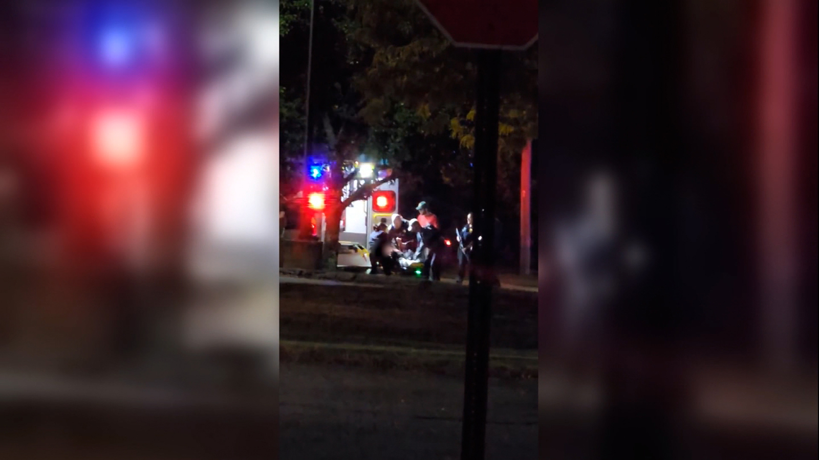 This picture shows a victim on a stretcher being loaded into an ambulance by first responders in Lewiston, Maine.