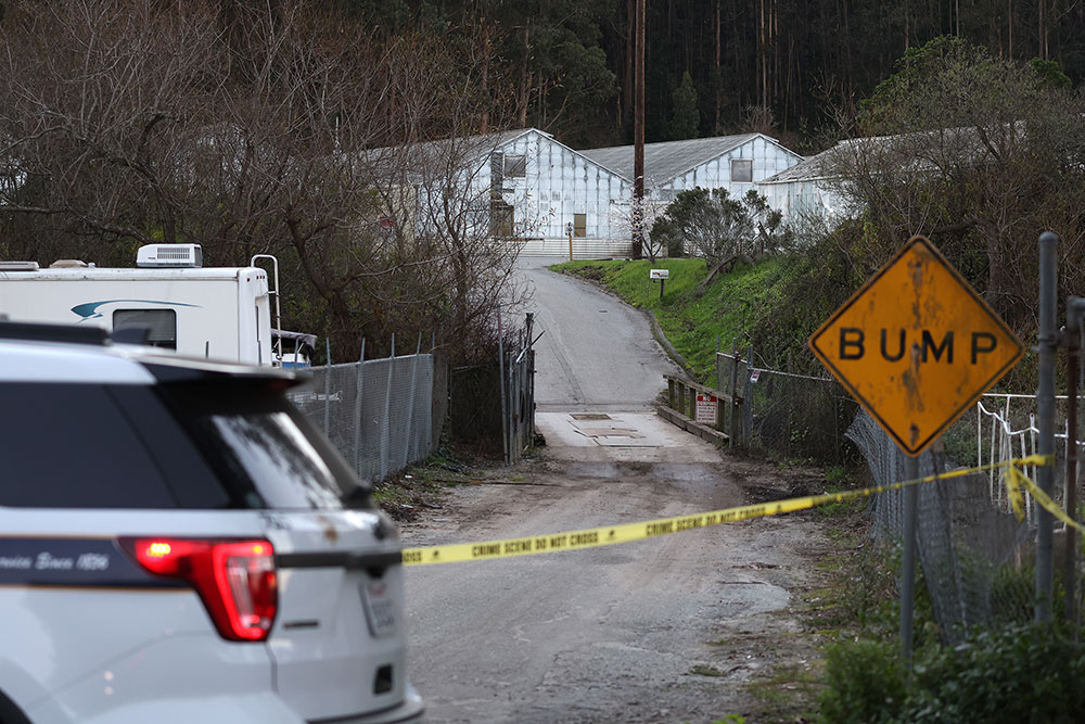 A San Mateo County sheriff's deputy blocks the entrance to one of the murder scenes on Jan. 24.