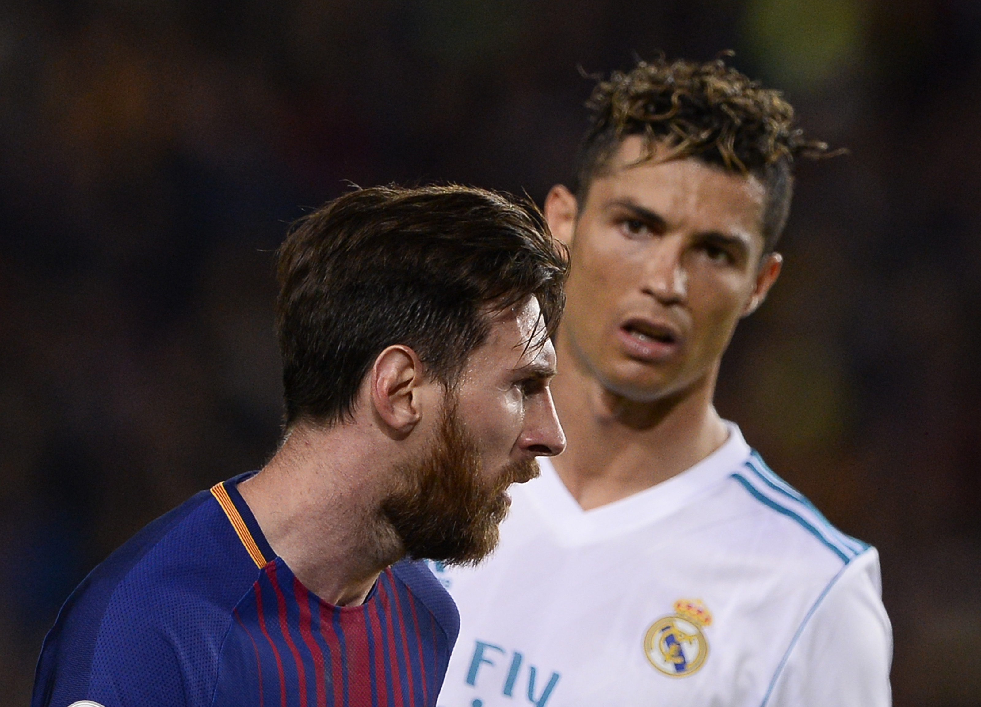 Lionel Messi and Cristiano Ronaldo in action for Barcelona and Real Madrid.