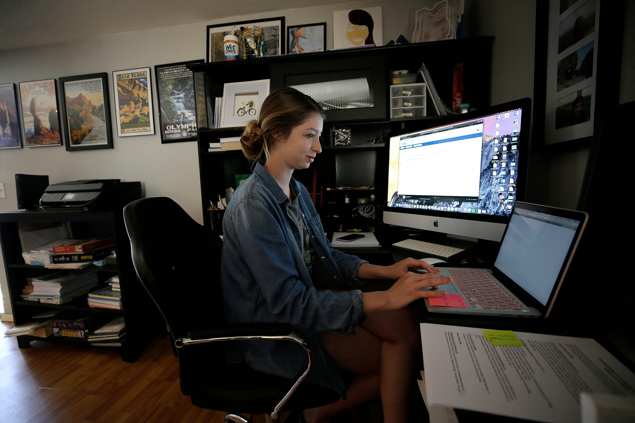 Gillian Barbour, a senior education student at Texas State University, works on her distance learning classes at home in El Paso, Texas, on March 30.