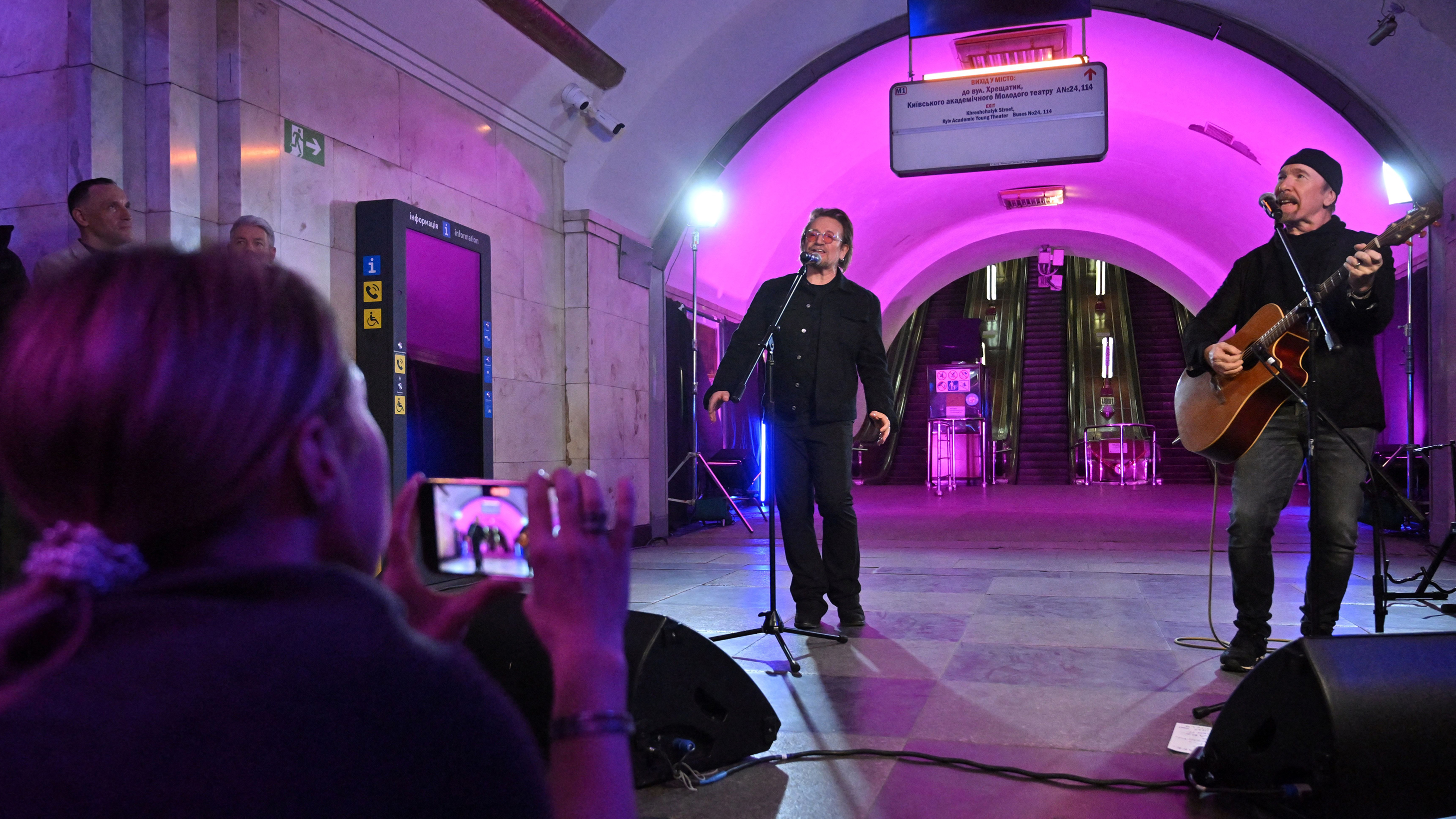 U2 singer Bono and guitarist, The Edge, perform at a metro station in Kyiv, Ukraine, on May 8. 