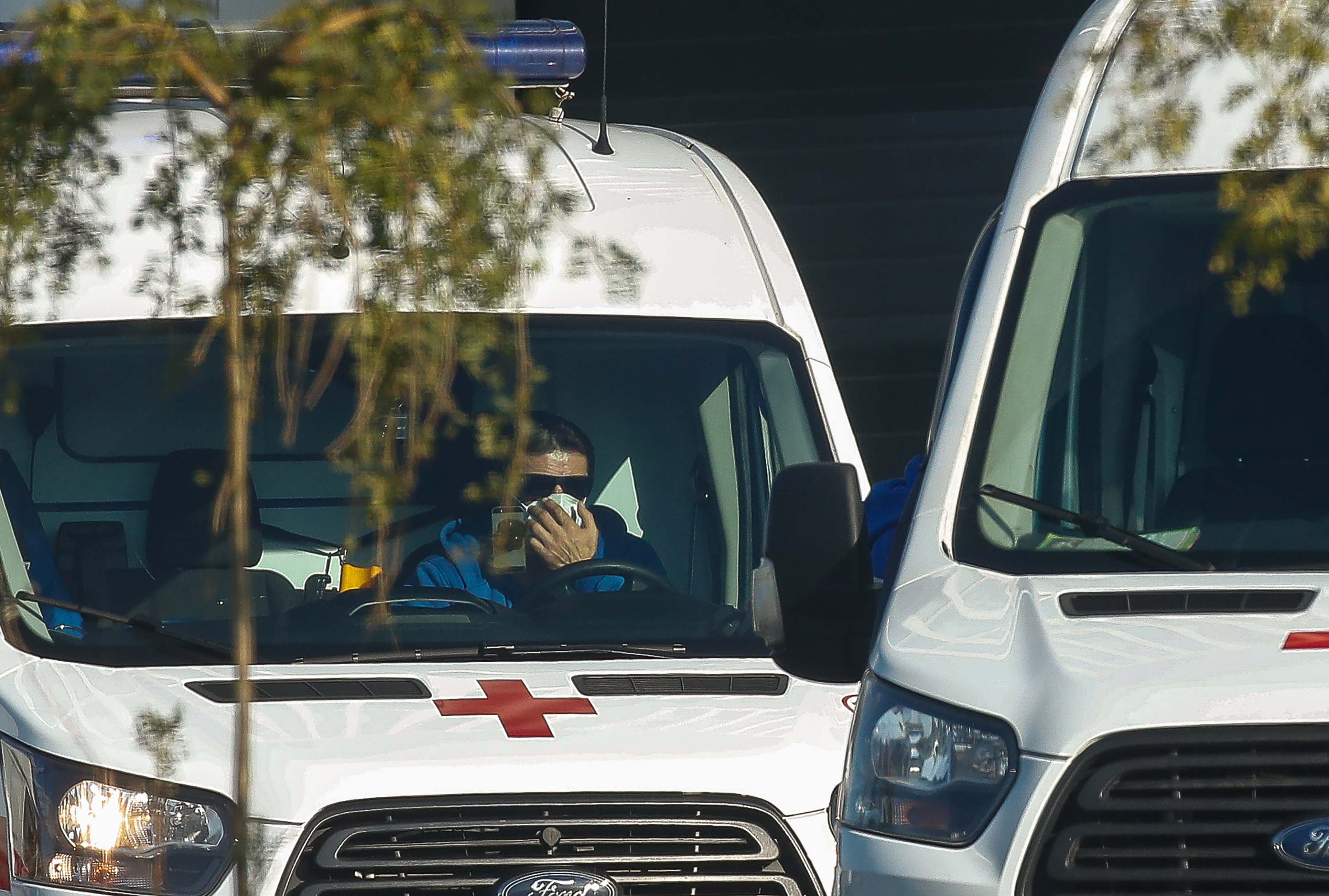 A ambulance crew member is seen parked outside the Novomoskovsky multipurpose medical center for patients with suspected Covid-19 infection in Moscow, on October 25.