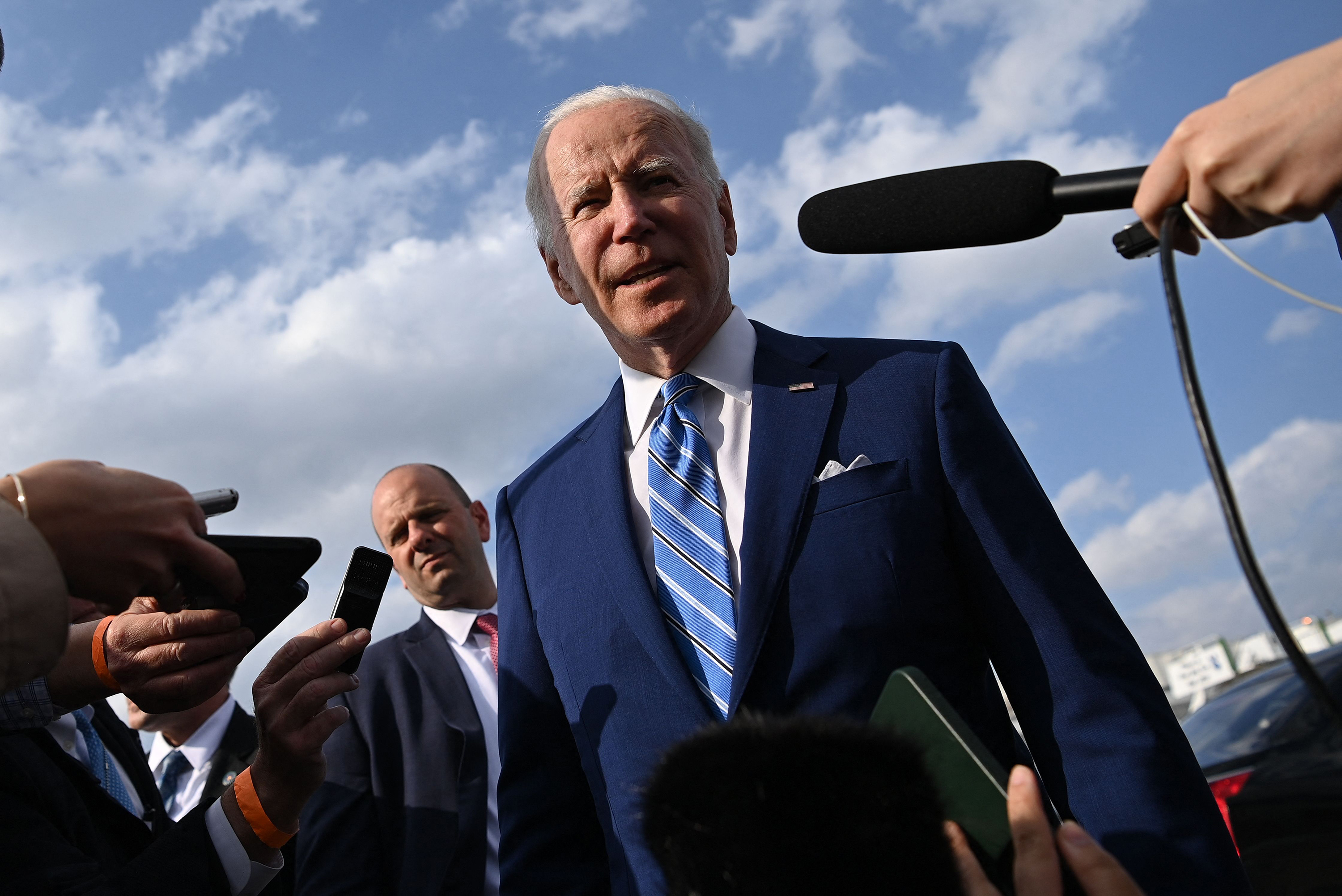 President Joe Biden speaks to the media before boarding Air Force One at Des Moines International Airport, in Des Moines, Iowa, on Tuesday, April 12, 2022.