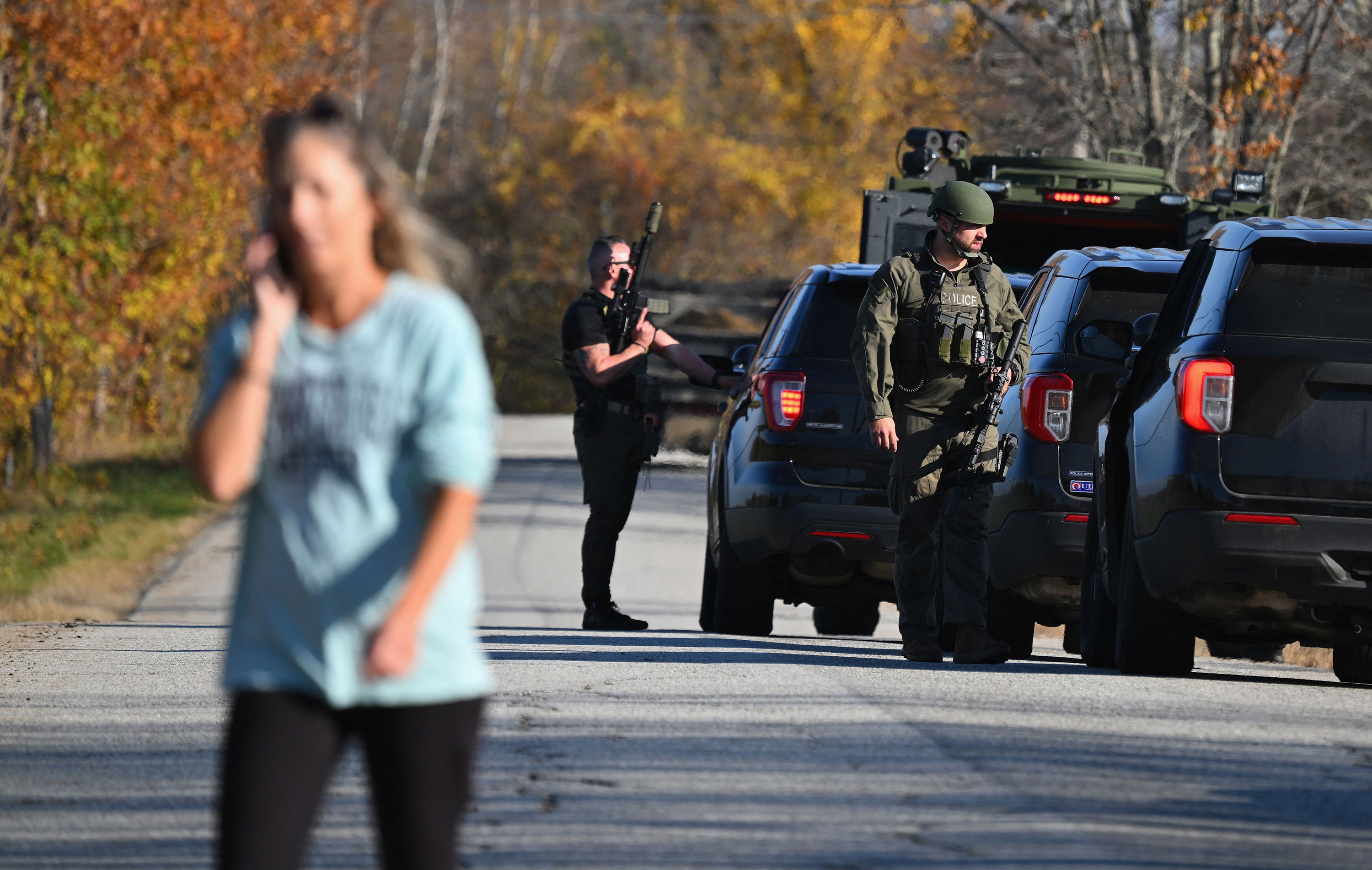 A local resident is sent away from an area searched by law enforcement in Monmouth, Maine on October 27, in the aftermath of a mass shooting in Lewiston, Maine.