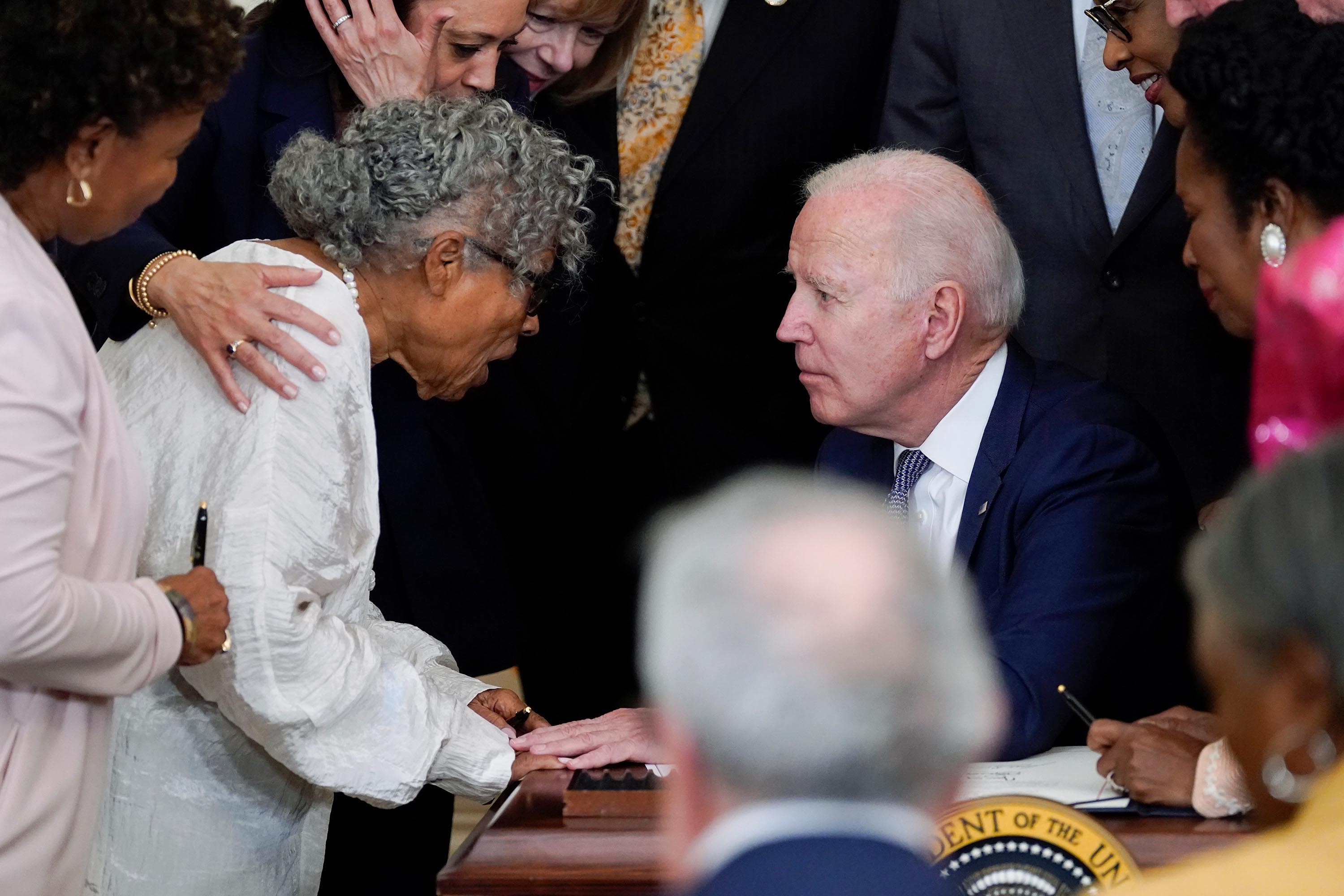 President Joe Biden speaks with Opal Lee after he signed the Juneteenth National Independence Day Act, in the East Room of the White House, Thursday, June 17.