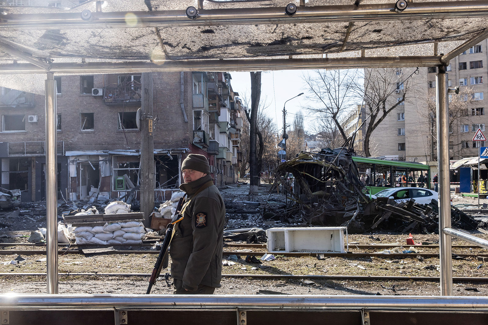 A Ukrainian soldier stands among debris from a damaged apartment block in Kyiv on March 14.