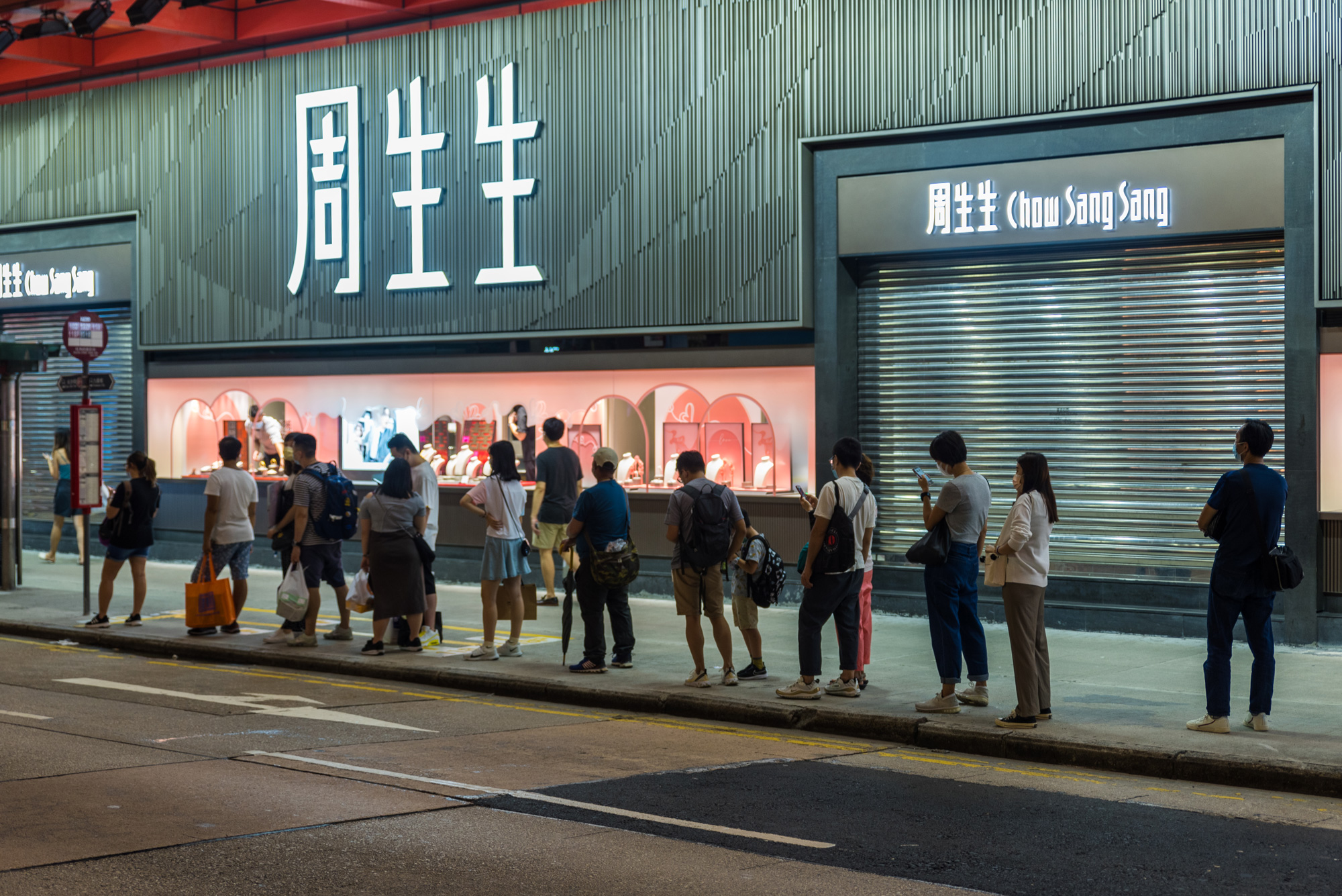 Commuters await a bus in Mongkok in Hong Kong on August 3. 