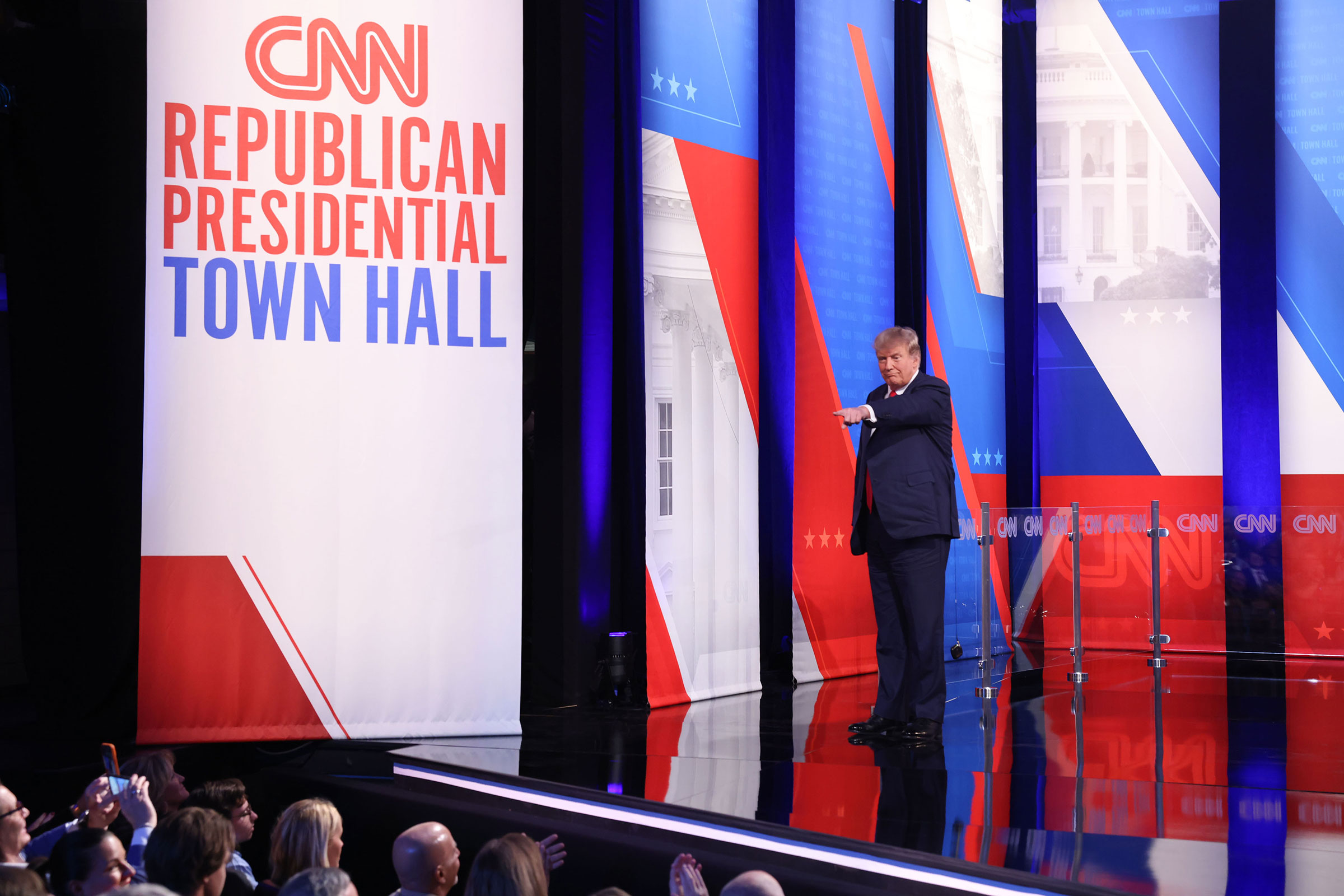 Former President Donald Trump points to an audience member during the CNN Republican Presidential Town Hall in Manchester, New Hampshire.