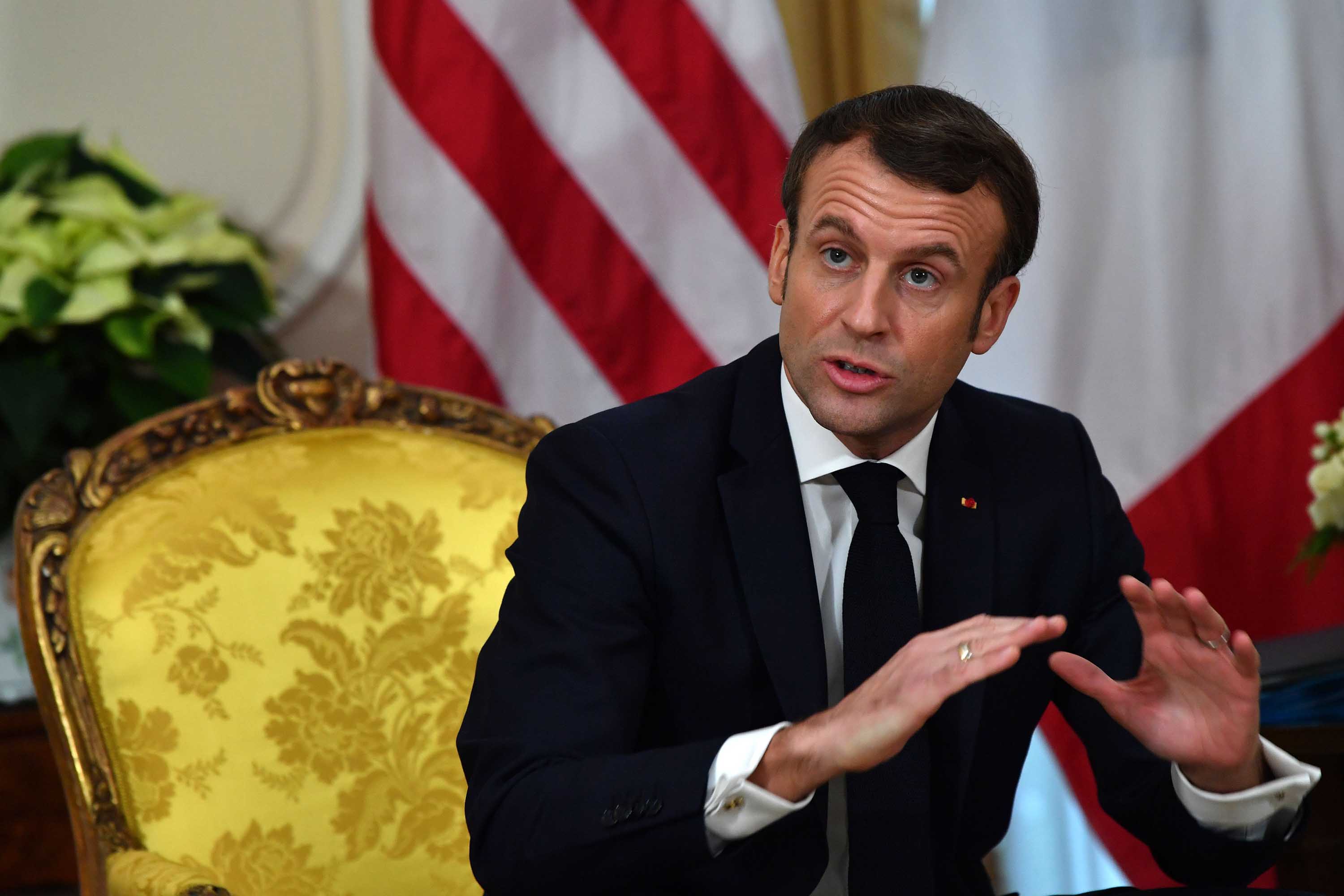 French President Emmanuel Macron speaks during a meeting with US President Donald Trump on Tuesday in London. 