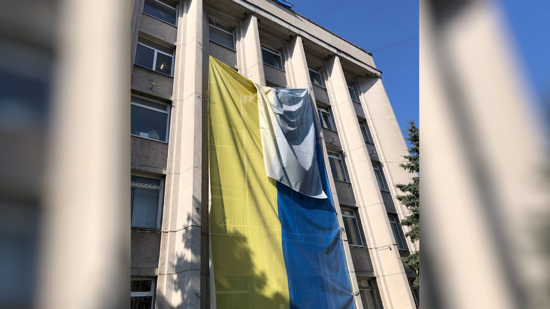 The Ukrainian flag is draped in front of the Kherson City Hall on March 24. 