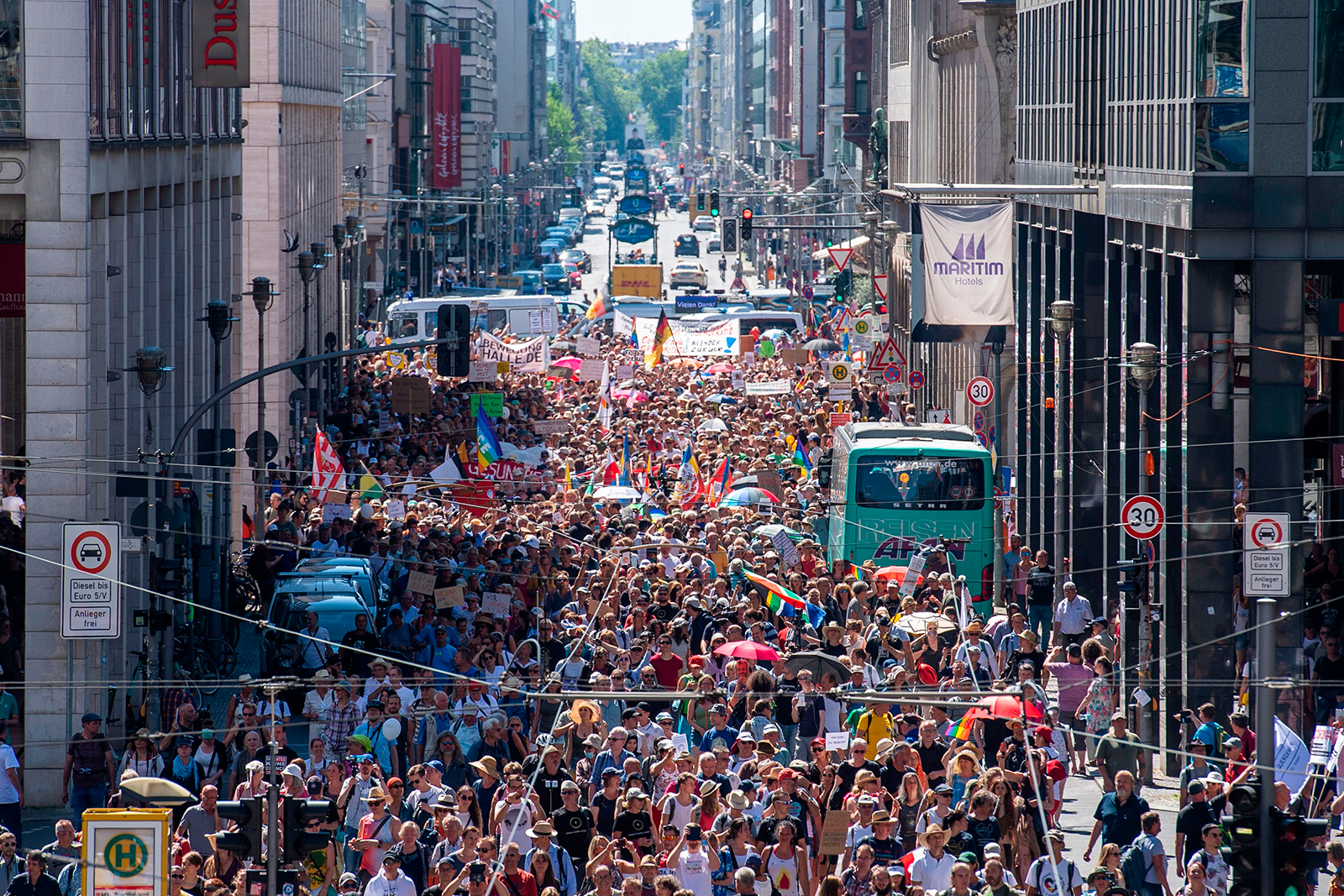 Thousands of demonstrators march down Friedrichstrasse to protest against the current measures to curb the spread of Covid-19, in Berlin, on August 1.