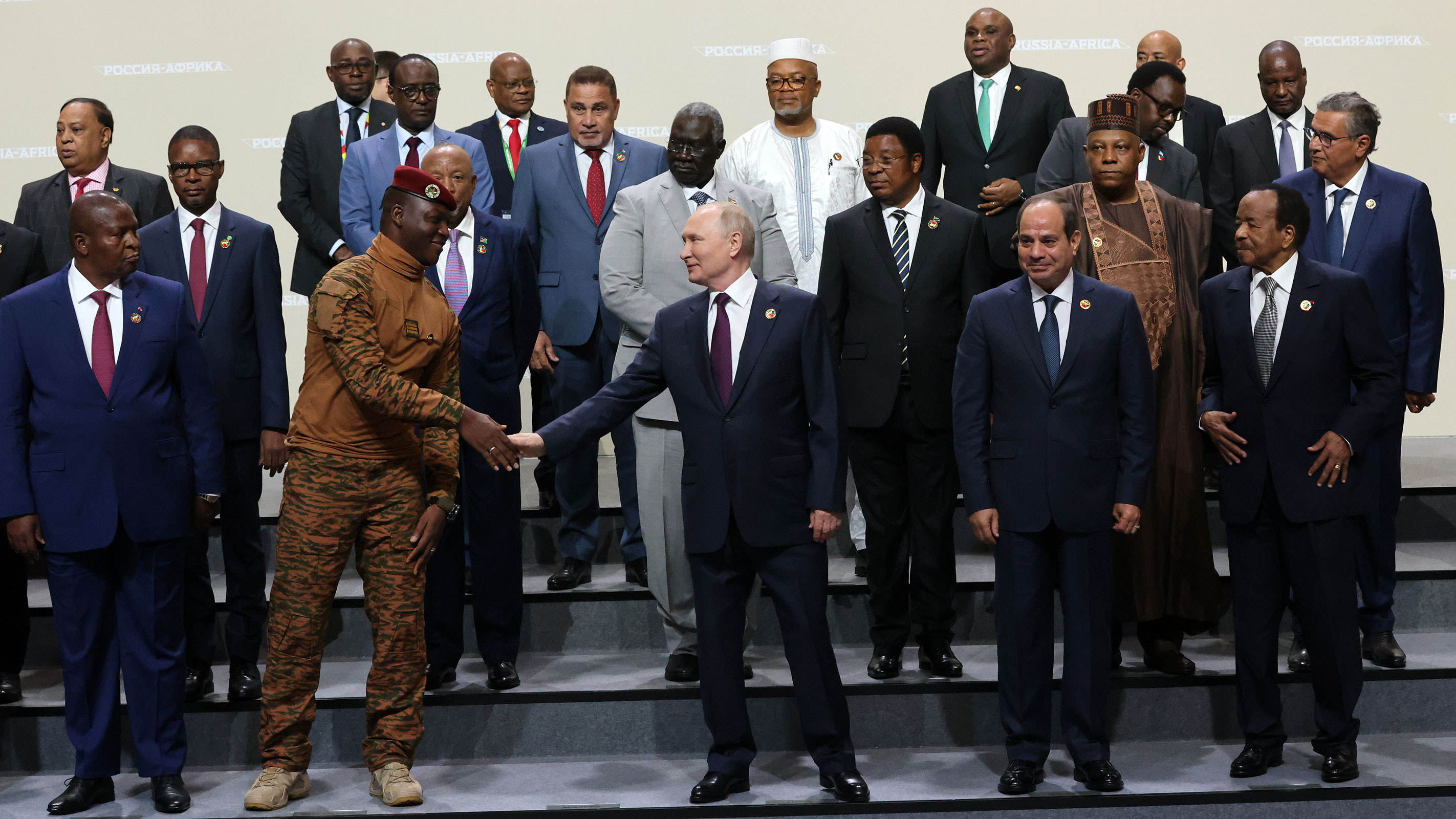 Russian President Vladimir Putin shakes hands with President of Burkina Faso Ibrahim Traore during a group photo with delegation's leaders of the Second Summit Economic And Humanitarian Forum Russia Africa, on July 28, 2023, in Saint Petersburg, Russia.