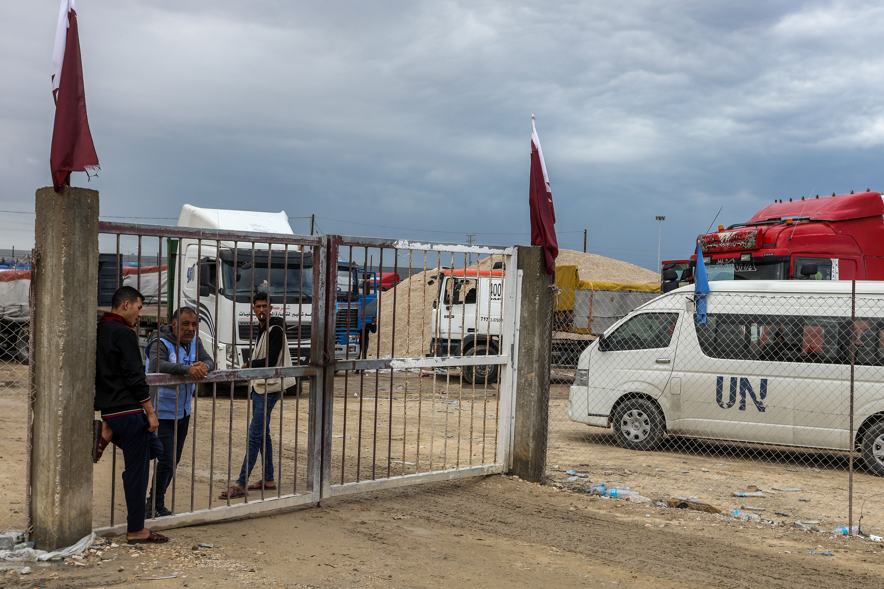 Members of the United Nations supervise as trucks loaded with aid and food enter Gaza through the Kerem Shalom crossing on November 15.