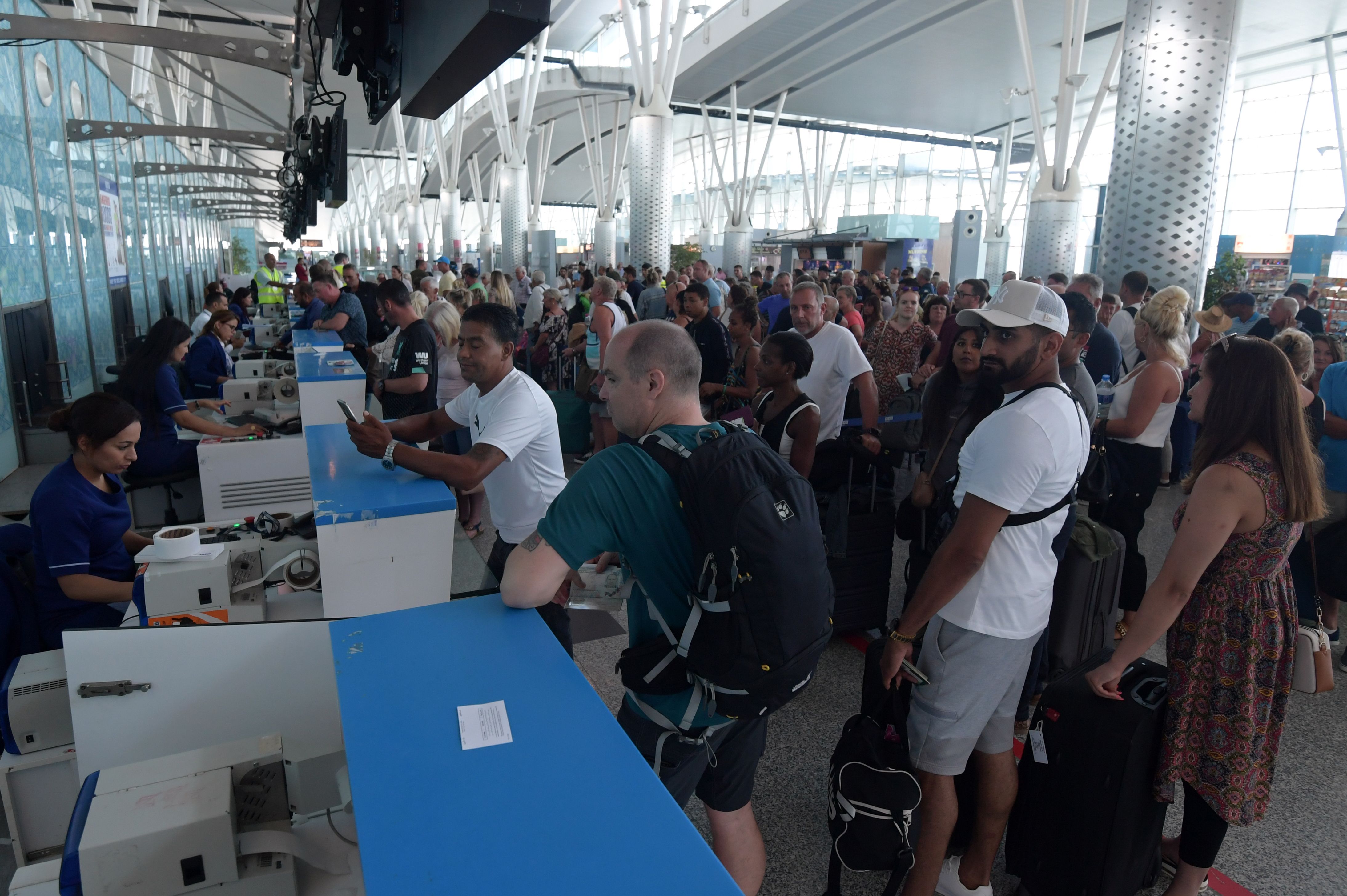 British tourists, flying with Thomas Cook, queue at the Enfidha International Airport in Tunisia September 23, 2019.