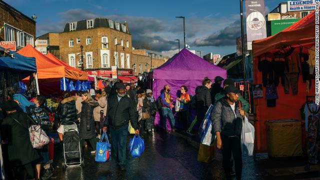 Shoppers browse stalls at Ridley Road Market in the Hackney district of London, UK, on March 18, 