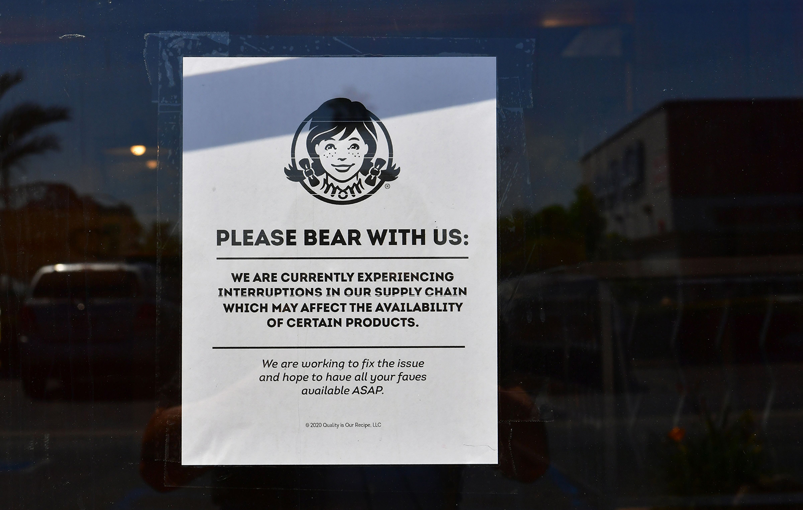 A sign posted on a walk-in entrance to a Wendy's fast food restaurant in Alhambra, California on May 5.