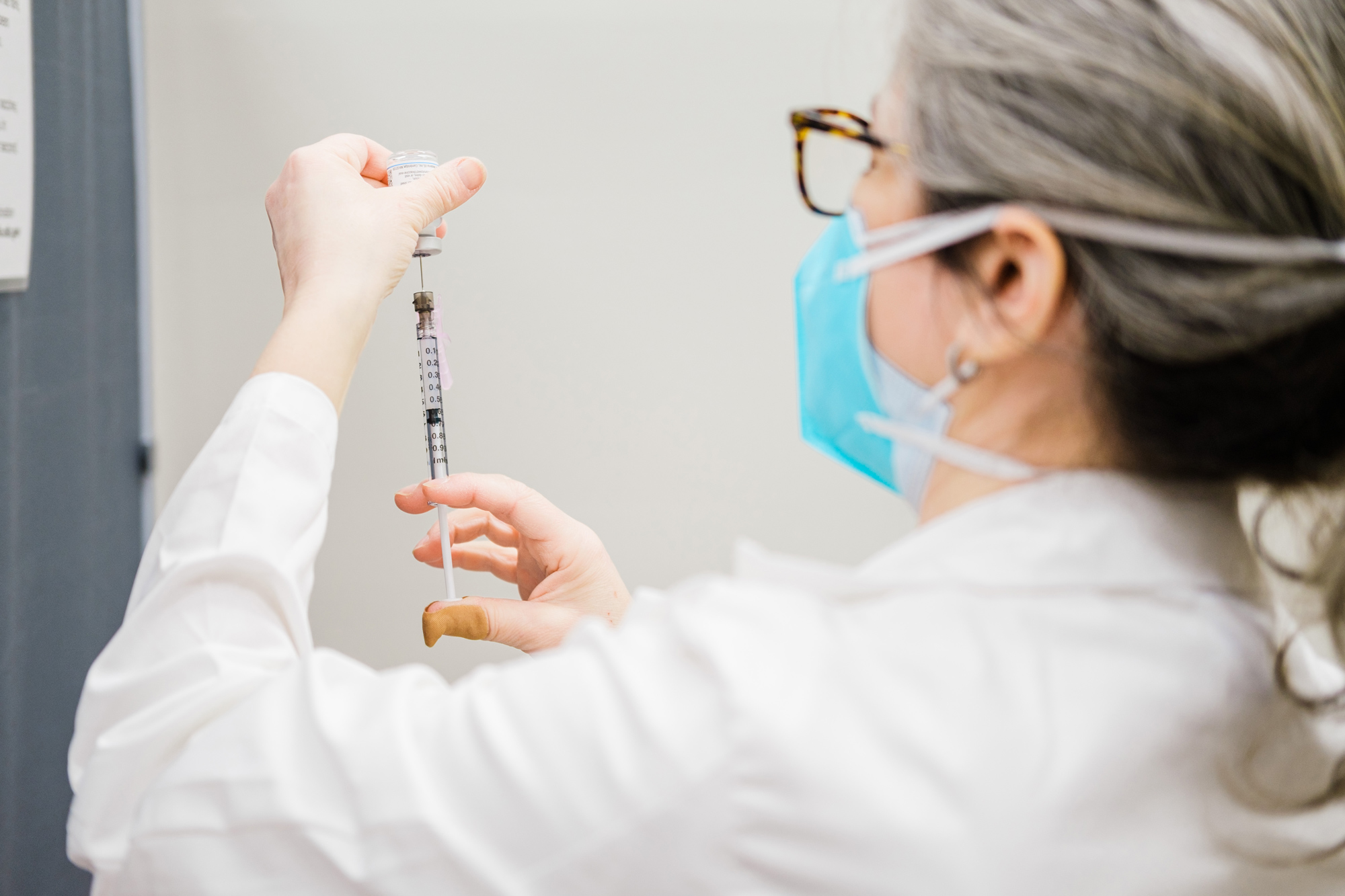 A pharmacists prepares a dose of the Moderna Covid-19 vaccination at a CVS Pharmacy location in Eastchester, New York, on February 12.