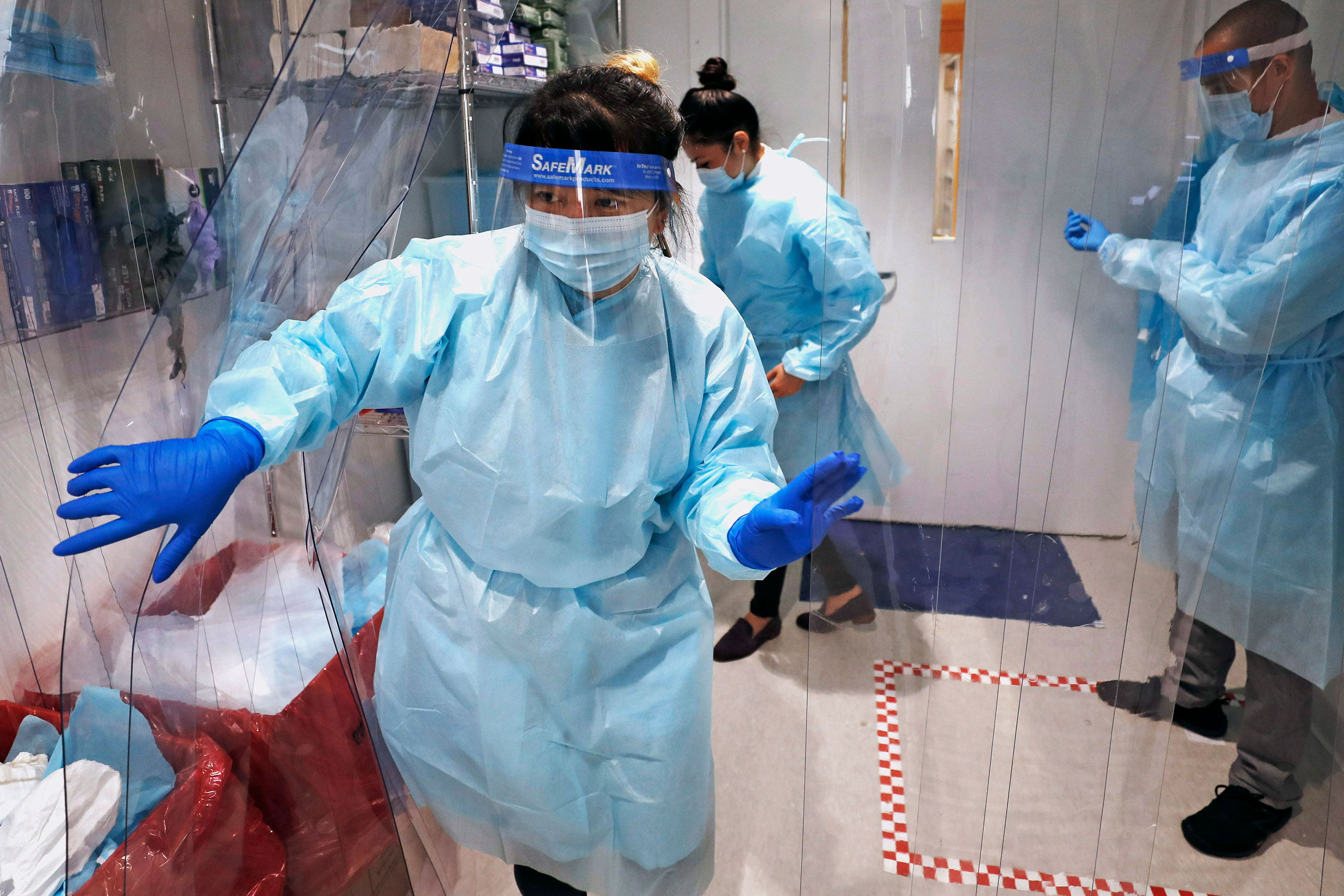 Medical personnel work at the on-campus coronavirus testing lab at Boston University on July 23 in Boston. 
