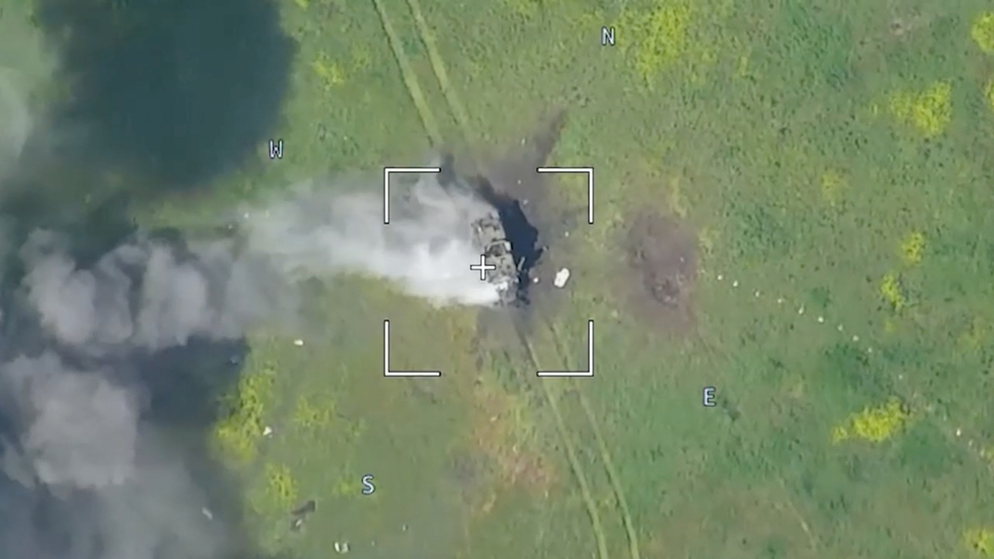 Drone footage released by Moscow on June 5 shows a burning armored vehicle in an unidentified location after the Russian defense ministry said its forces had thwarted a major Ukrainian offensive in the southern Ukrainian region of Donetsk.