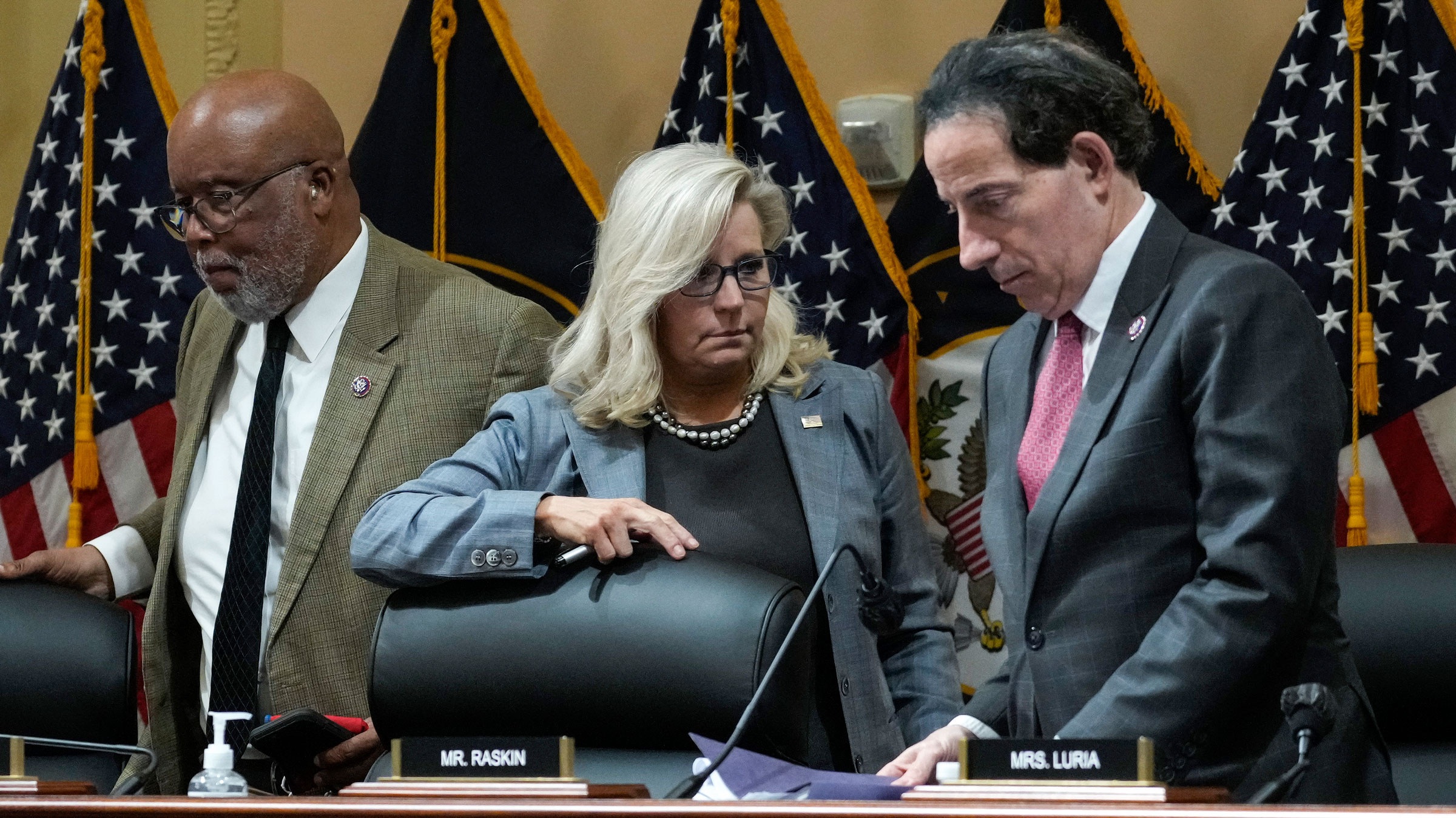 From left, US Reps. Bennie Thompson, Liz Cheney and Jamie Raskin leave after a committee meeting in March.