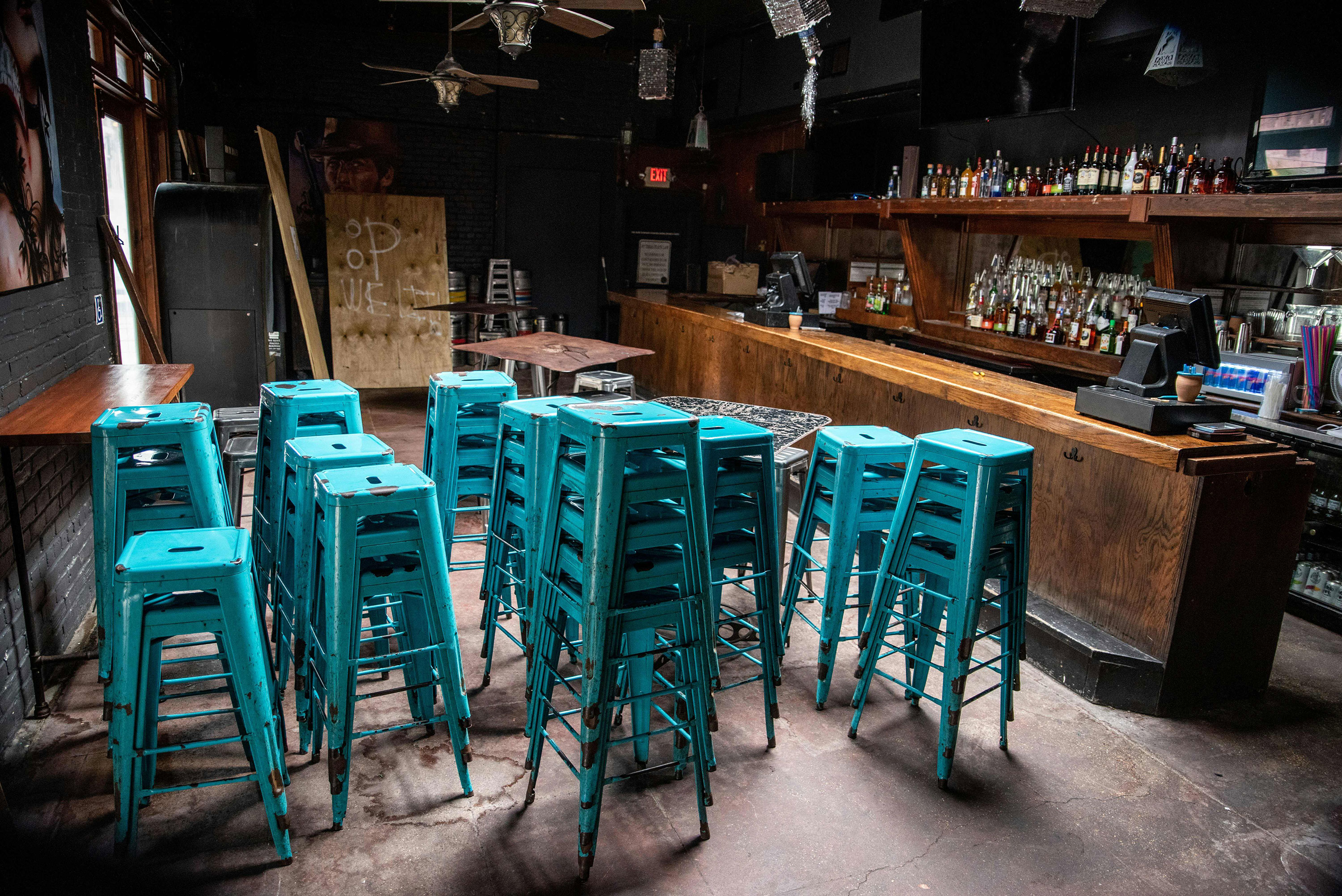 Stools sit stacked inside a closed bar in Austin, Texas, on June 26.
