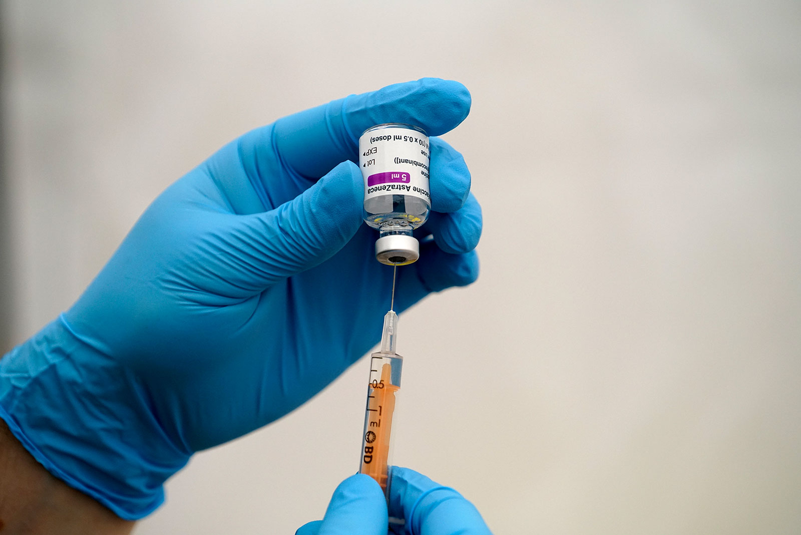 An NHS member prepares a dose of the AstraZeneca Covid-19 vaccine at Stithians Showground near Truro, England, on January 26.