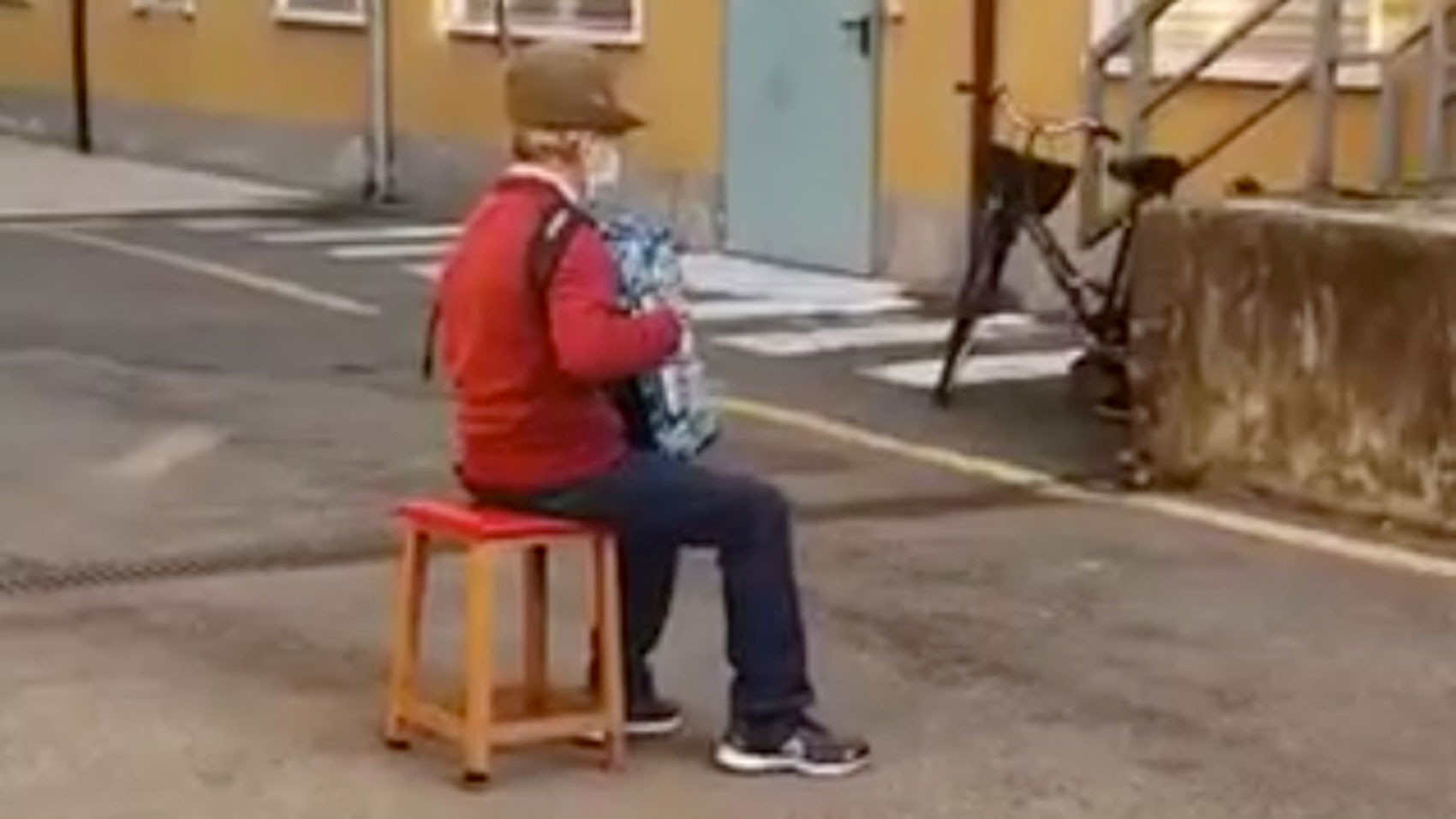 Stefano Bozzini, 81, serenades Carla Sacchi, his wife of 47 years, from beneath her hospital window in Emilia-Romagna, Italy. Covid-19 restrictions prevented him from visiting her.