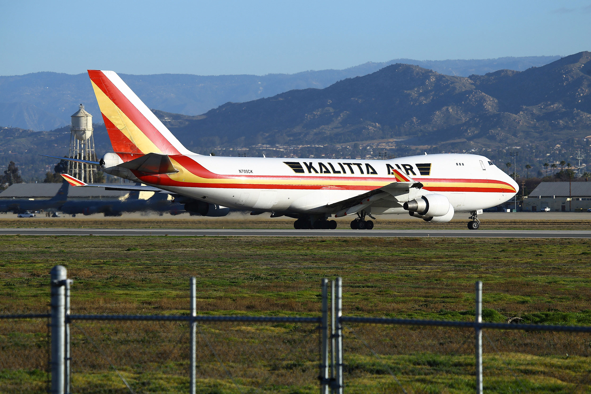 A charter plane carrying passengers evacuated from Wuhan, China, lands at March Air Reserve Base on January 29.