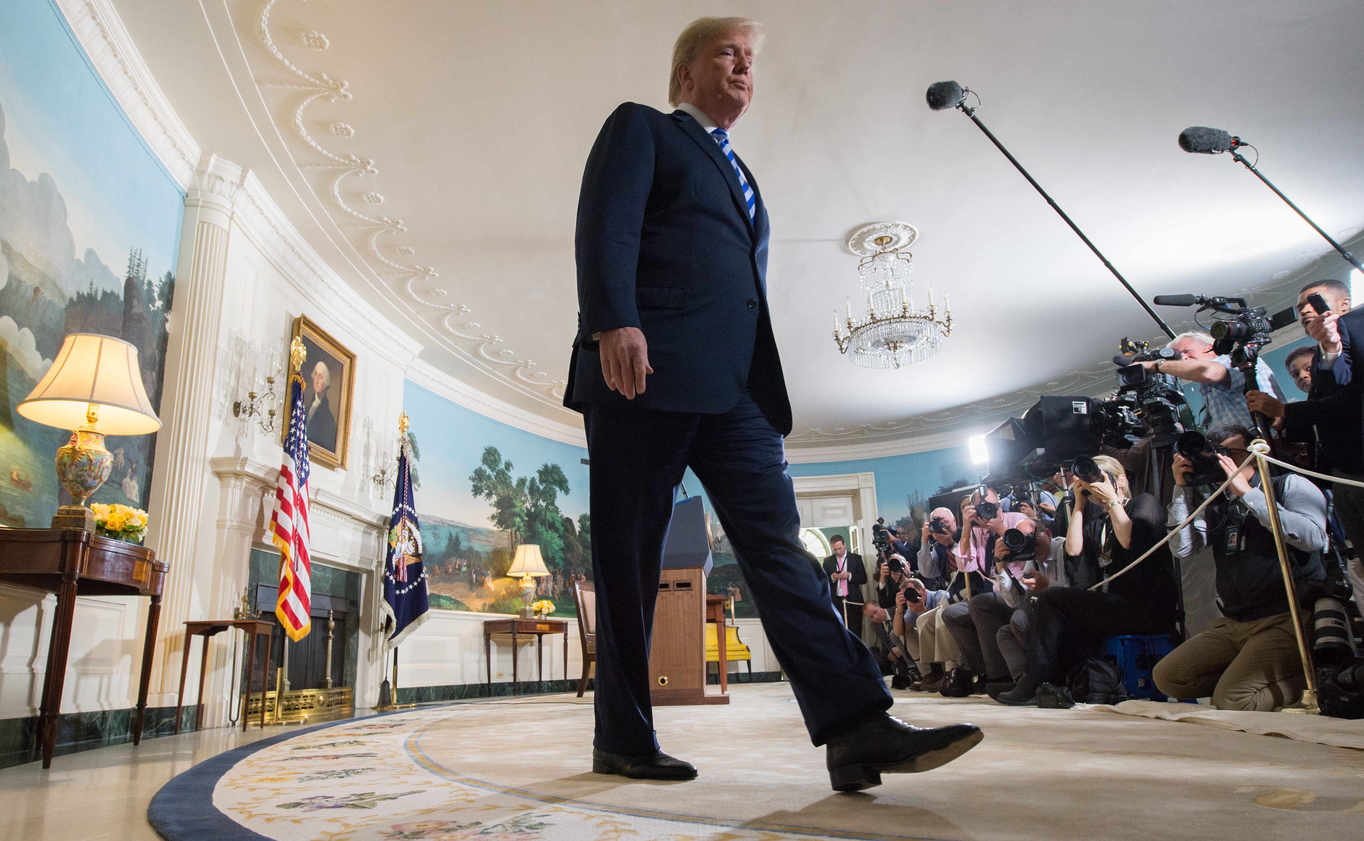 US President Donald Trump leaves after announcing his decision about the nuclear deal with Iran during a speech from the Diplomatic Reception Room at the White House in Washington, DC, May 8, 2018.