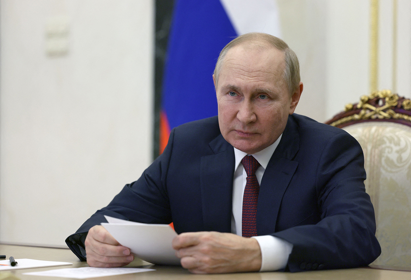 Russian President Vladimir Putin chairs a meeting via a video link in Moscow on September 29.