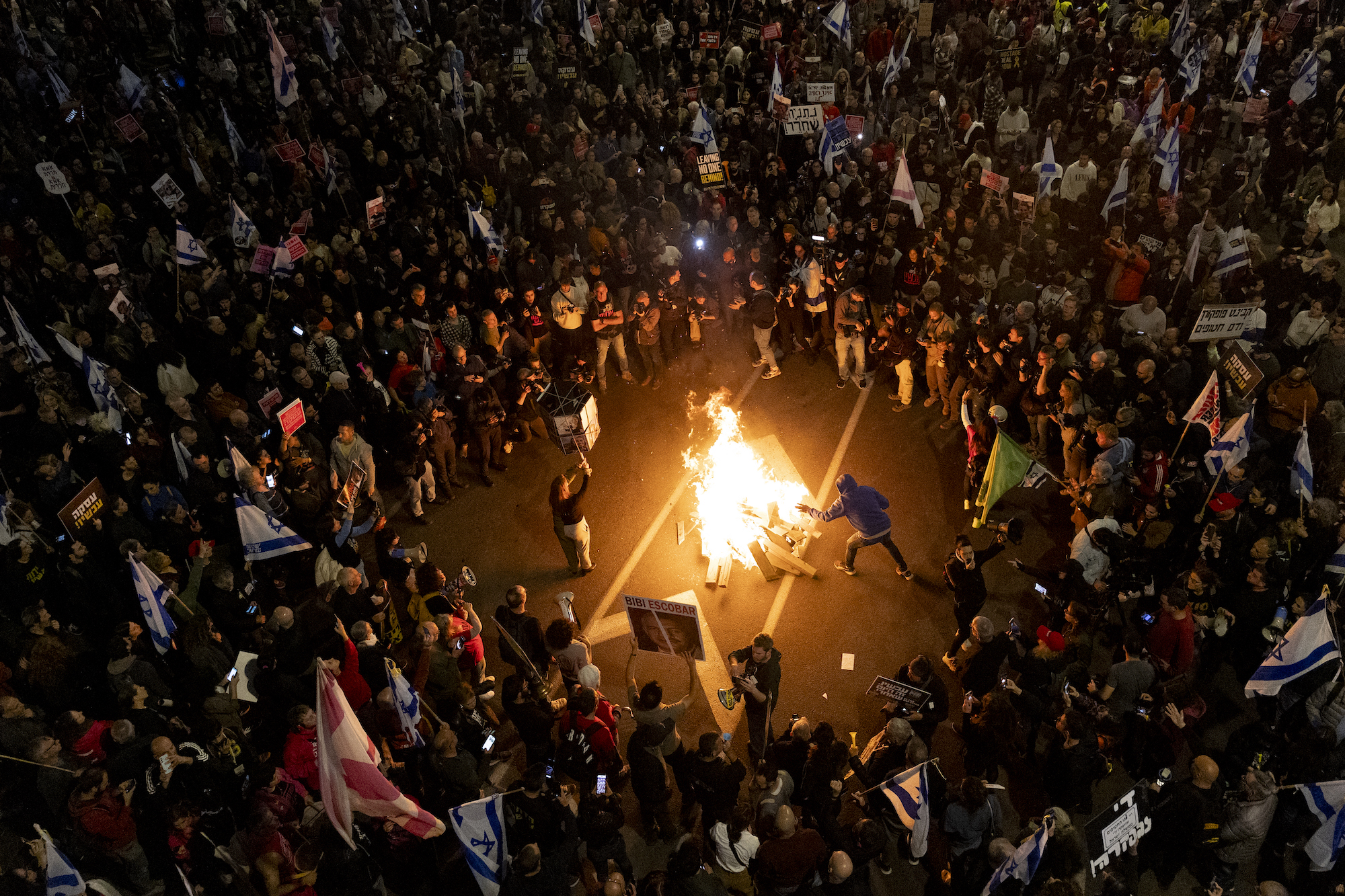Protesters set a fire in Tel Aviv on March 16.