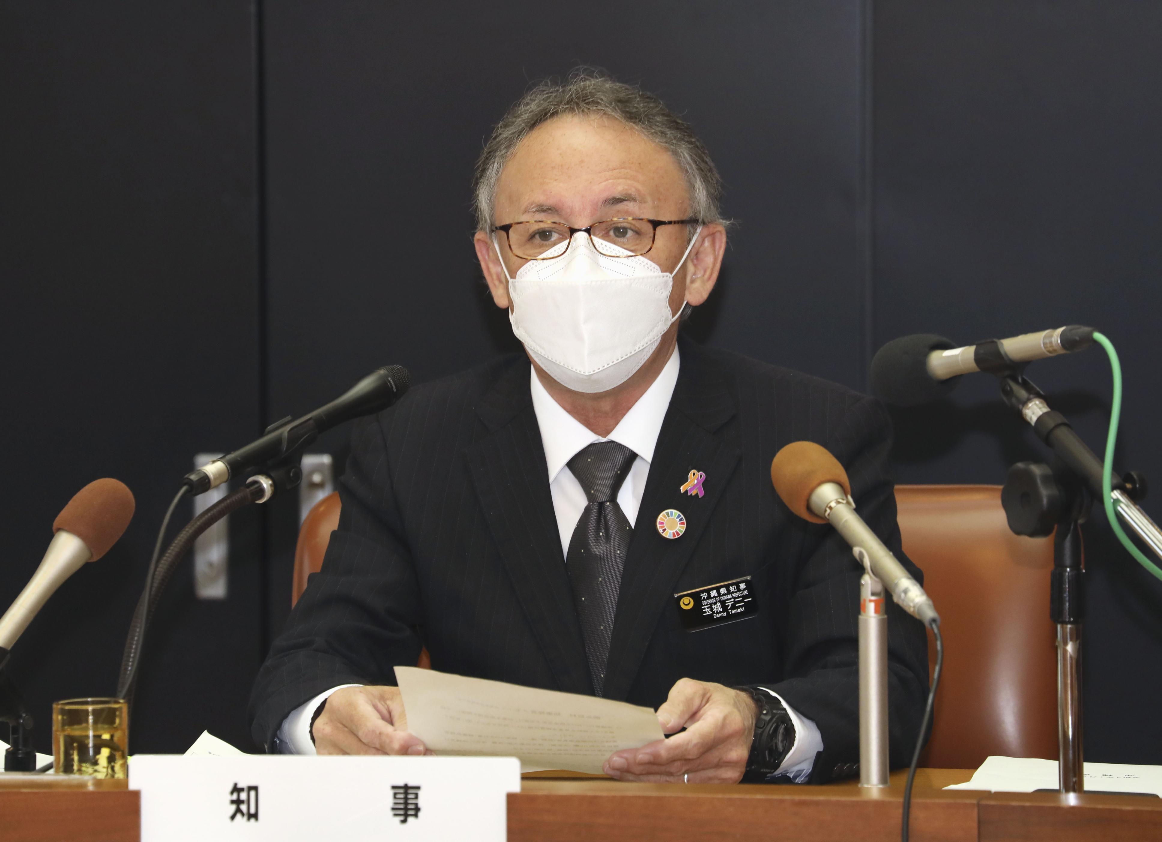 Okinawa Governor Denny Tamaki meets with the press at the prefectural headquarters in Naha, southern Japan, on January 6, amid a recent spike in coronavirus infections. 