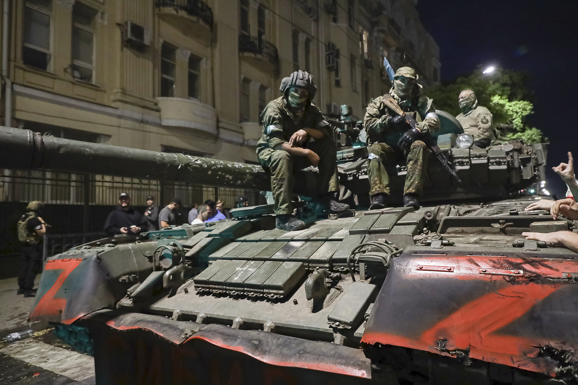 MembeRs of the Wagner Group military company sit atop of a tank on a street in Rostov-on-Don, Russia, on June 24.