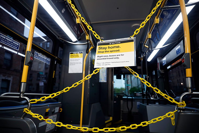 Chains separating the back half of a public bus from the driver's space hang to protect MTA bus drivers from COVID-19 exposure, on Friday, April 24, in the Bronx borough of New York. 