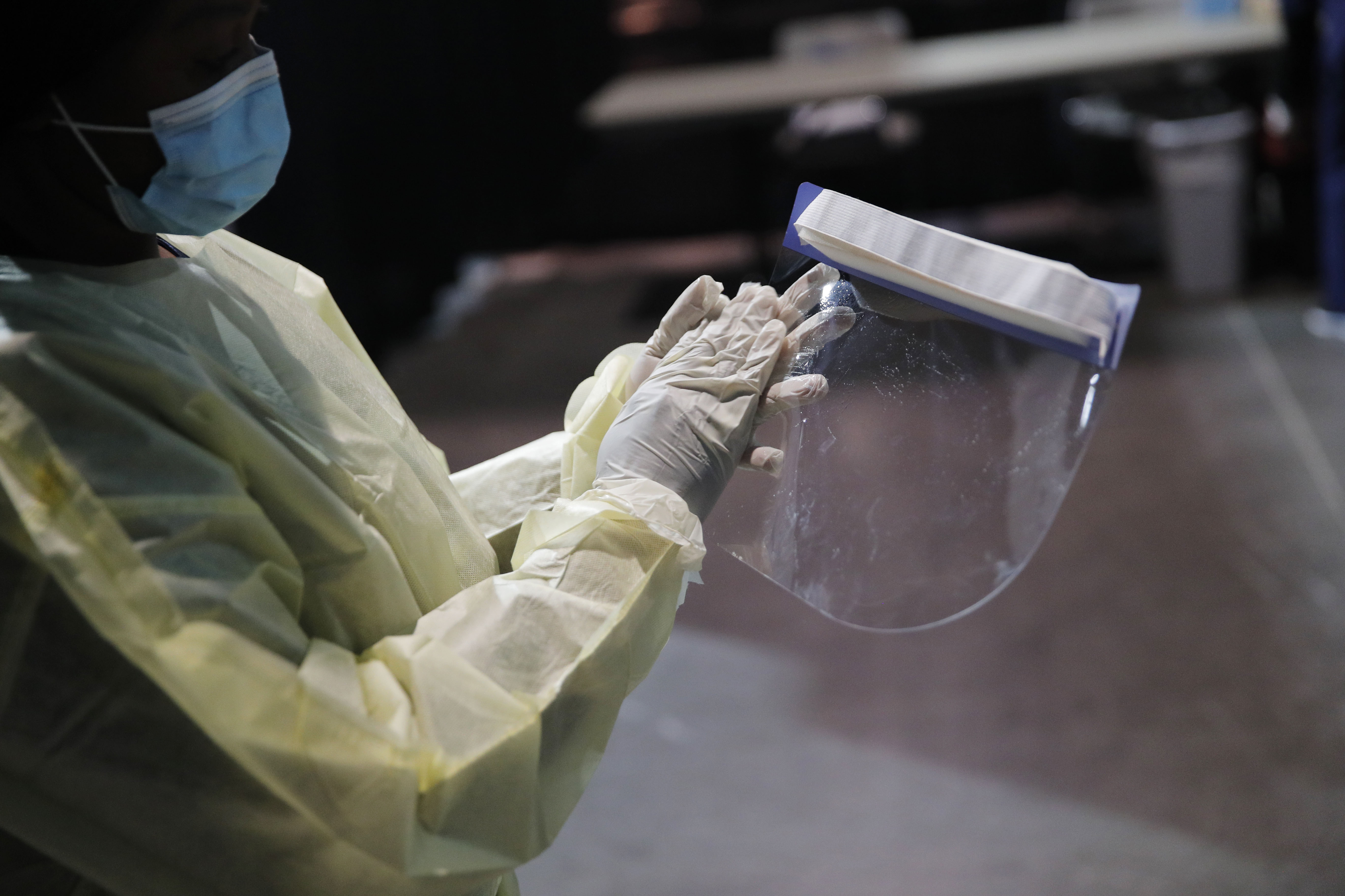 A registered nurse cleans personal protective equipment at the Las Vegas Convention Center in Nevada on May 21, before the opening of a temporary coronavirus testing facility for casino employees.
