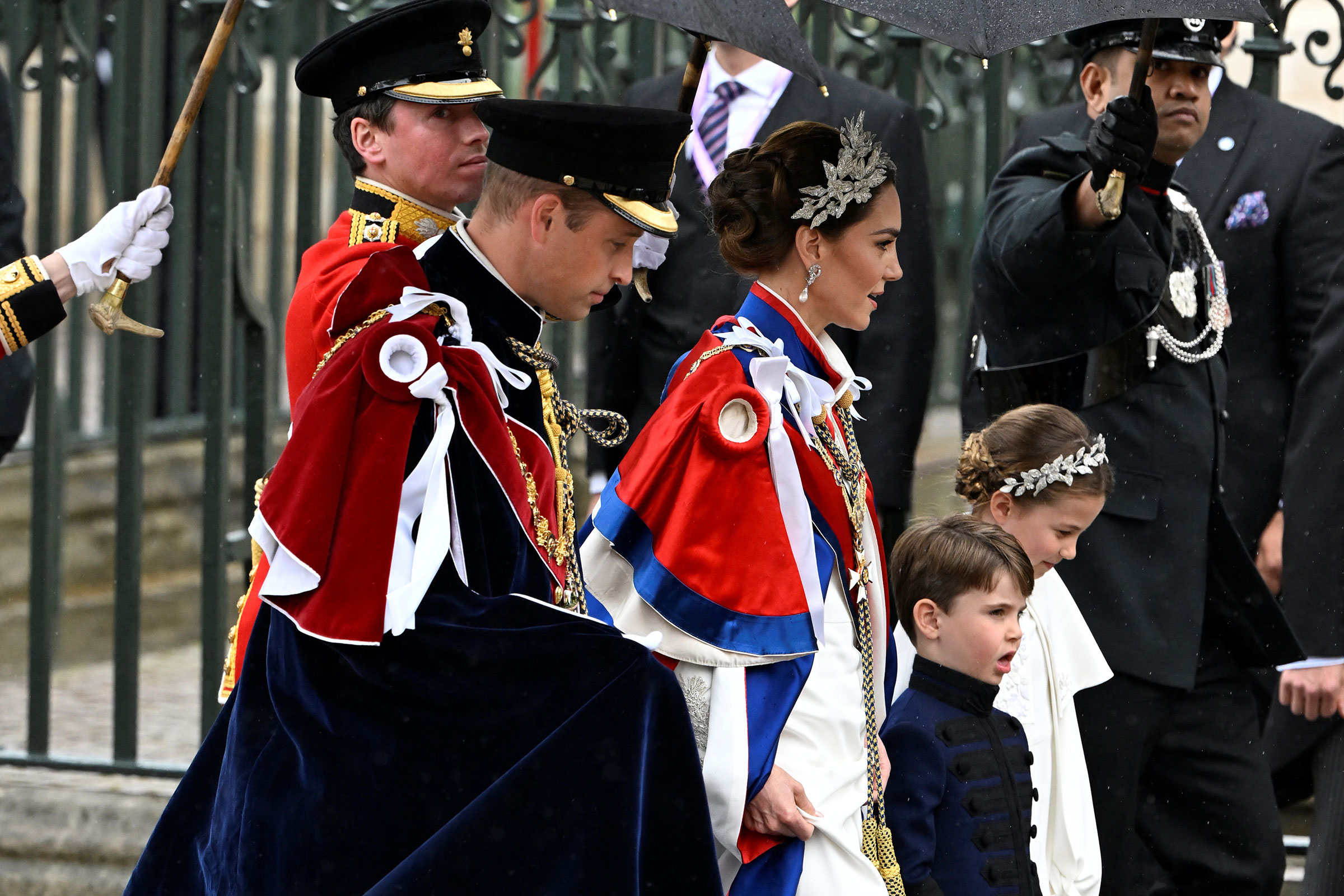 Britain's Prince William, Catherine, Princess of Wales, and their children Princess Charlotte and Prince Louis arrive at Westminster Abbey.