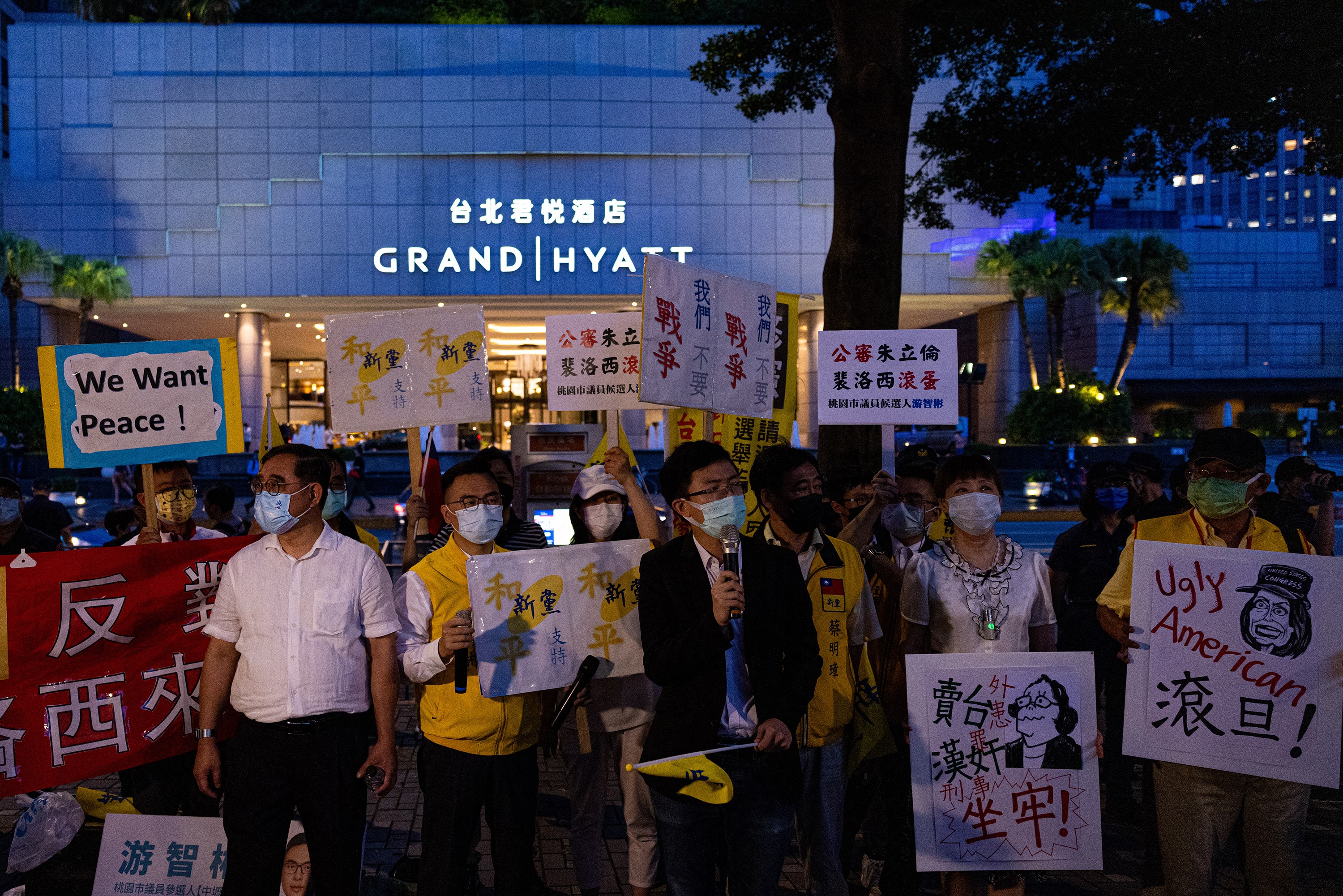 Demonstrators take part in a protest against US House Speaker Nancy Pelosi's visit on Tuesday night in Taipei, Taiwan, outside the Grand Hyatt Taipei hotel.