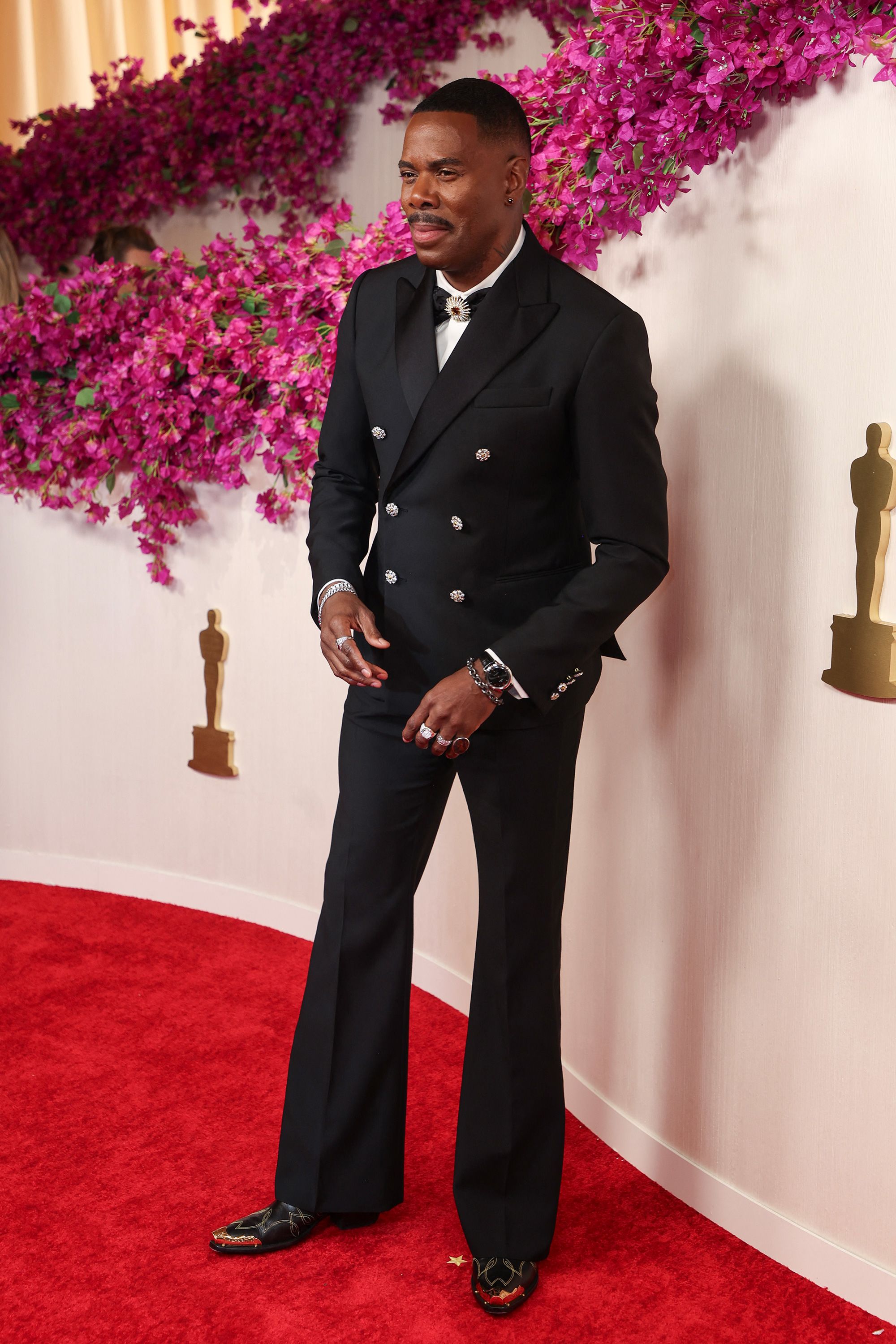 Best Actor nominee Colman Domingo also wore Louis Vuitton, a black double breasted suit with statement bowtie and jewelry by David Yurman. "I wanted to just shine like a diamond," he told Laverne Cox during E’s red carpet coverage. 
