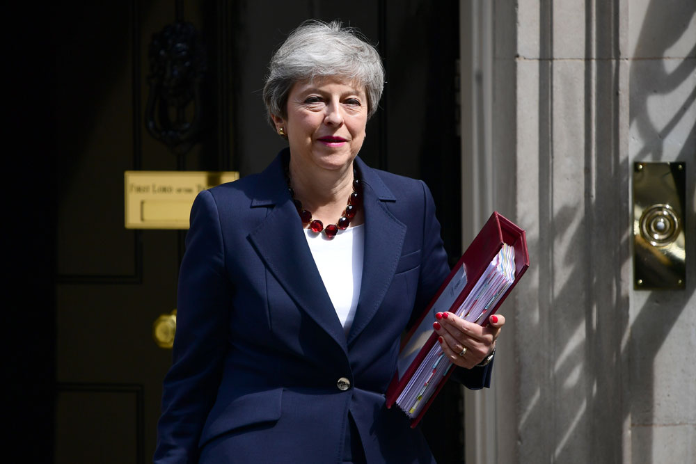 Former UK prime minister Theresa May leaves Downing Street in this July 17, 2019 file photo in London, England.